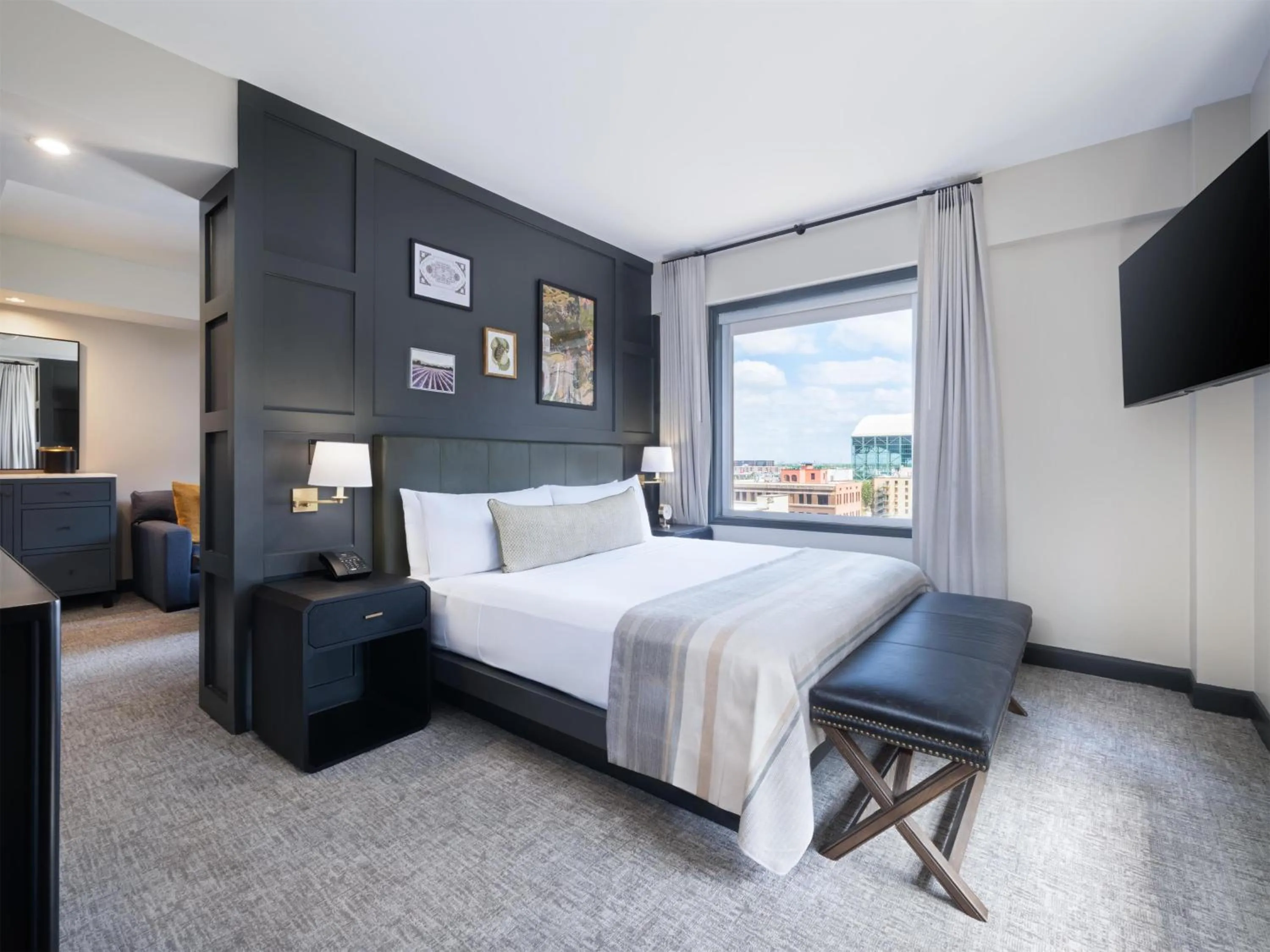 Bed in The Sam Houston Hotel, Curio Collection by Hilton