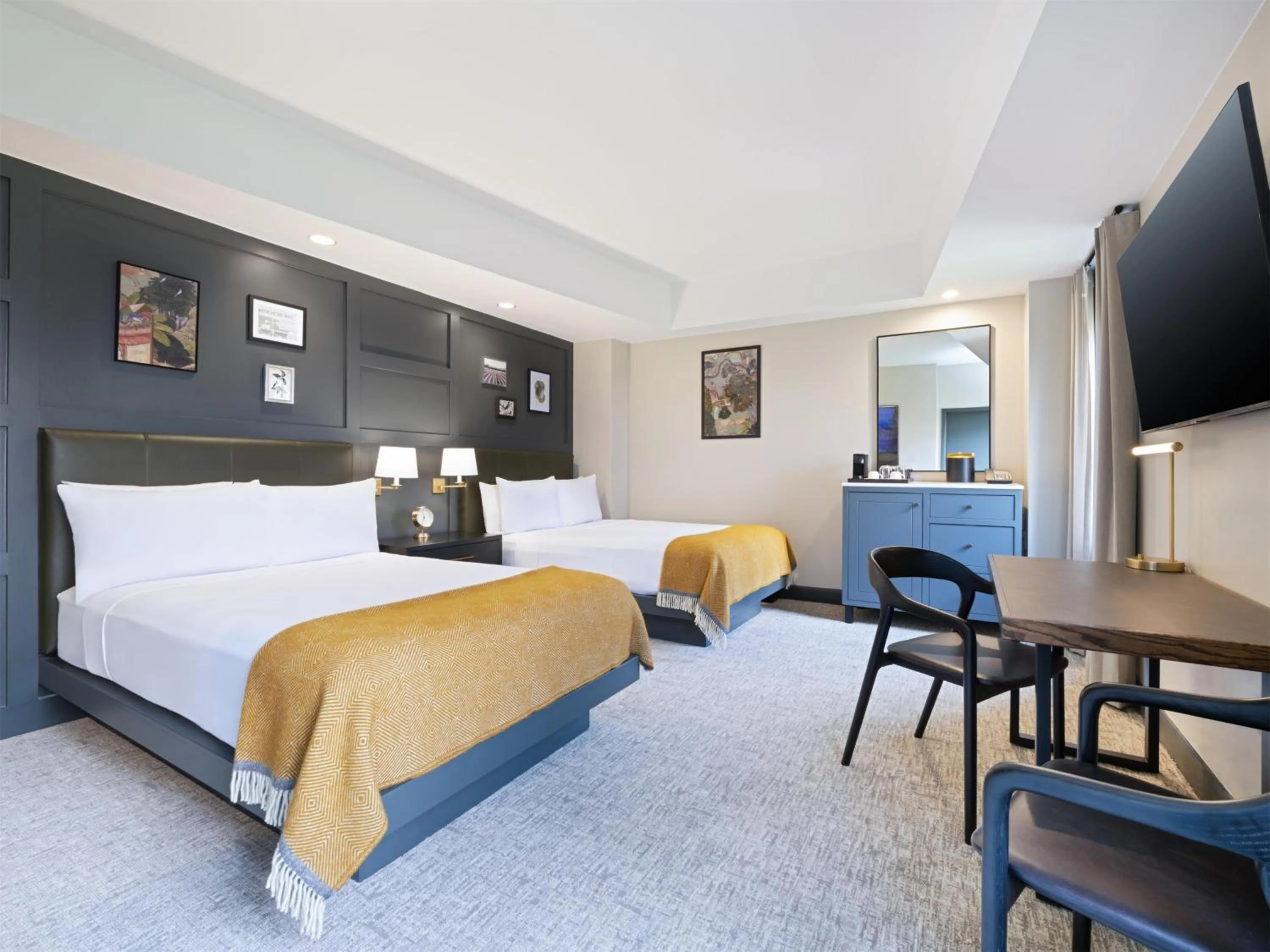 Bed in The Sam Houston Hotel, Curio Collection by Hilton