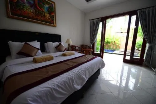 Bed in Surya Guest House Sanur
