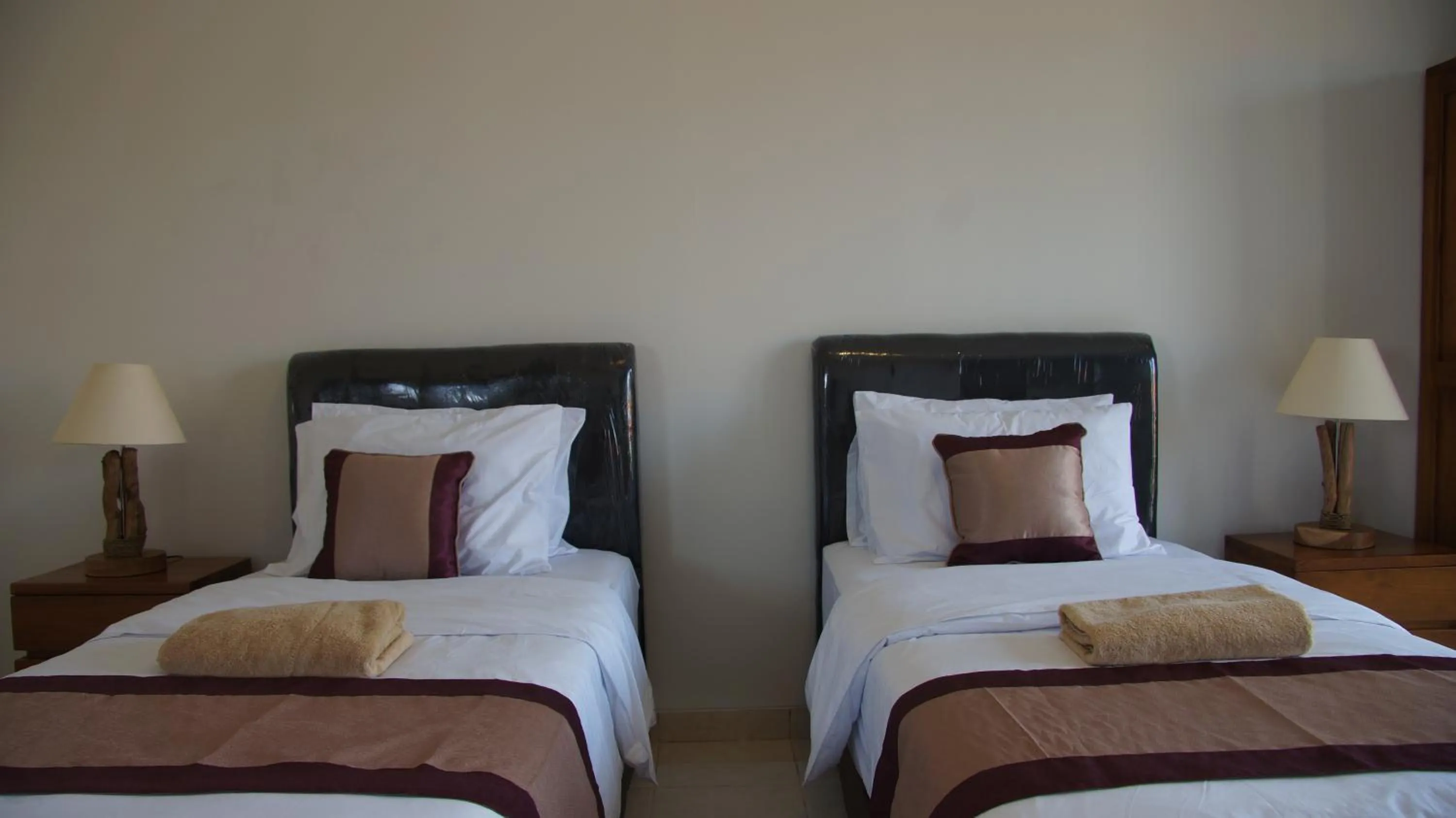 Bed in Surya Guest House Sanur