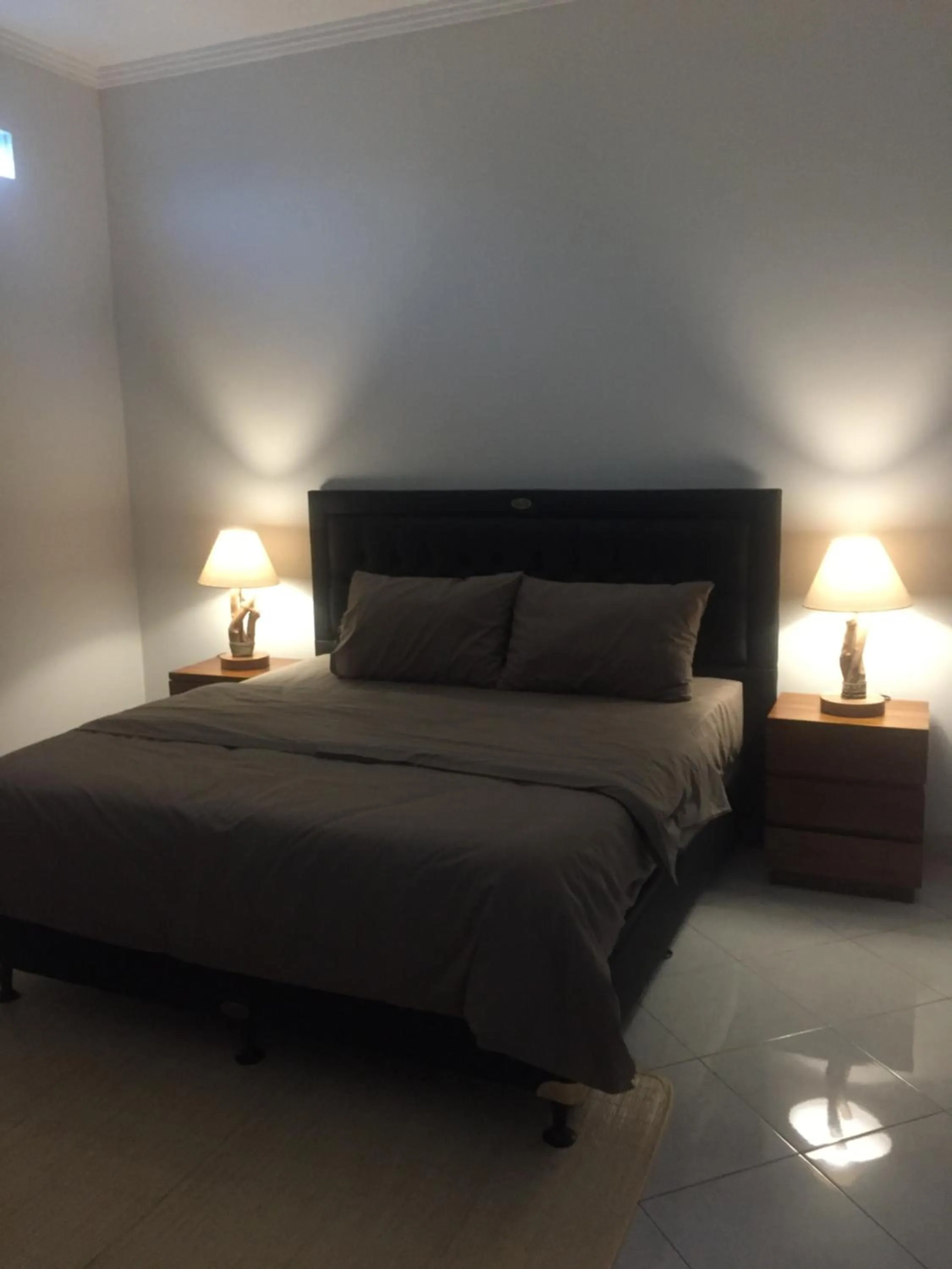 Bed in Surya Guest House Sanur