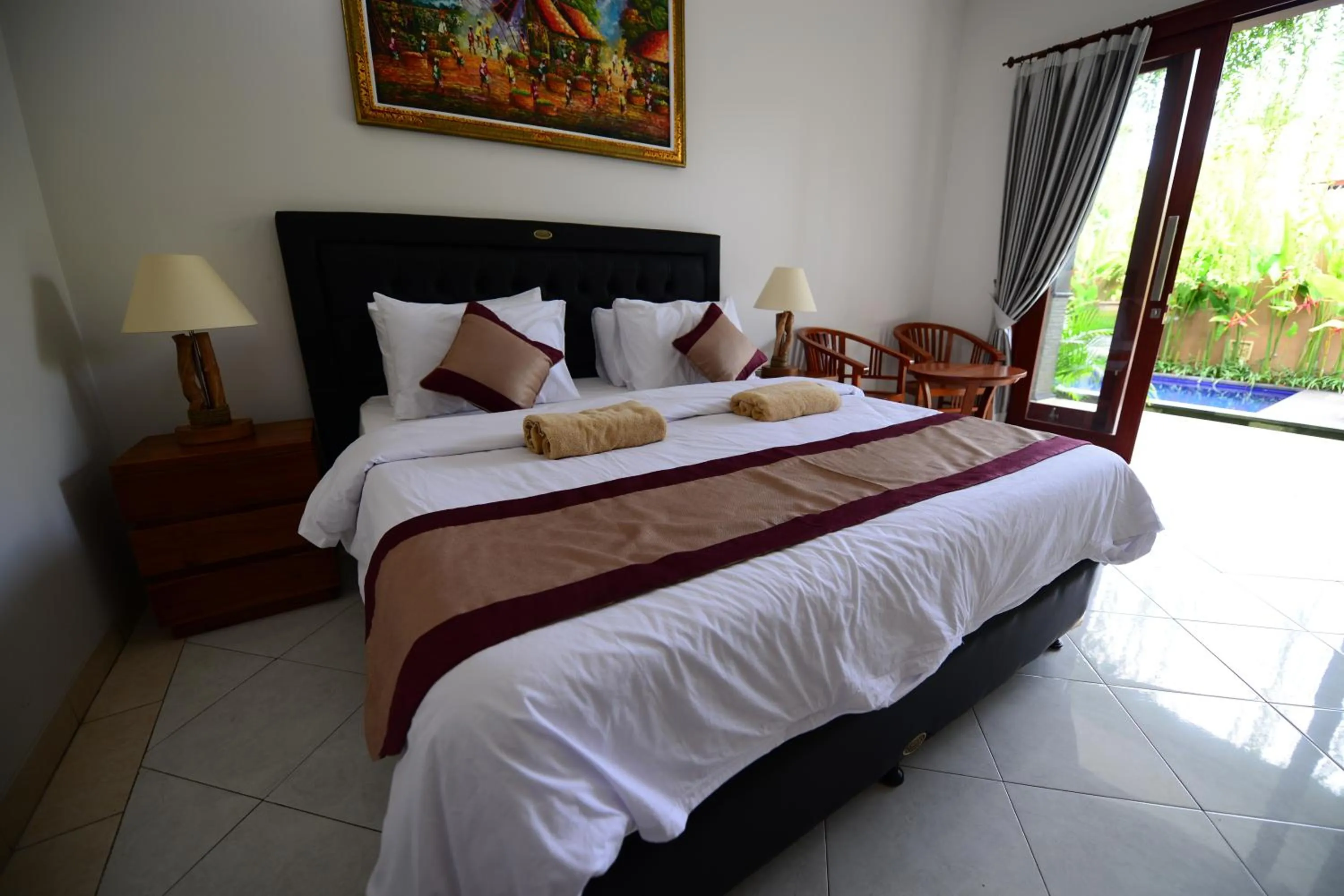 Bed in Surya Guest House Sanur