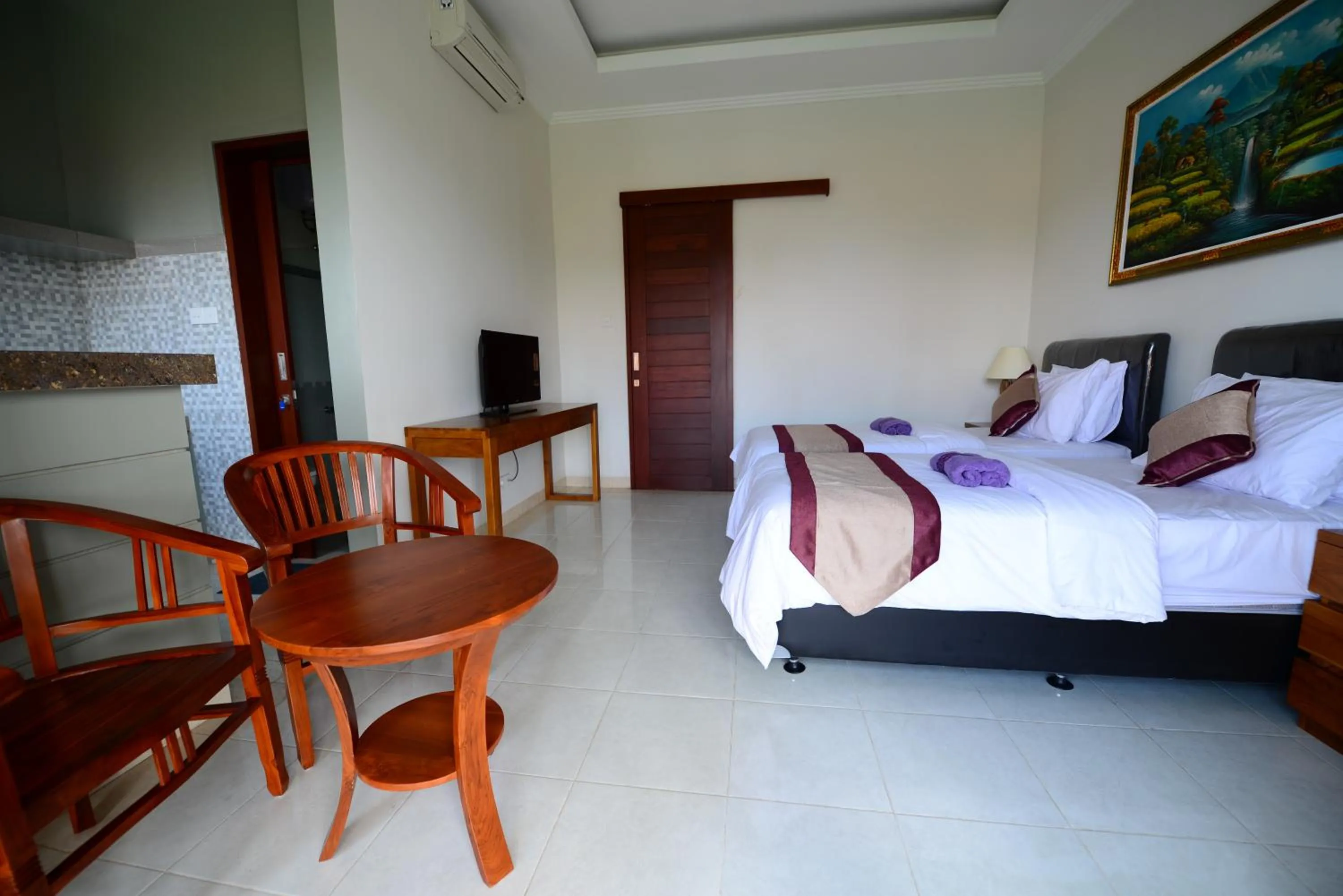 Bed in Surya Guest House Sanur