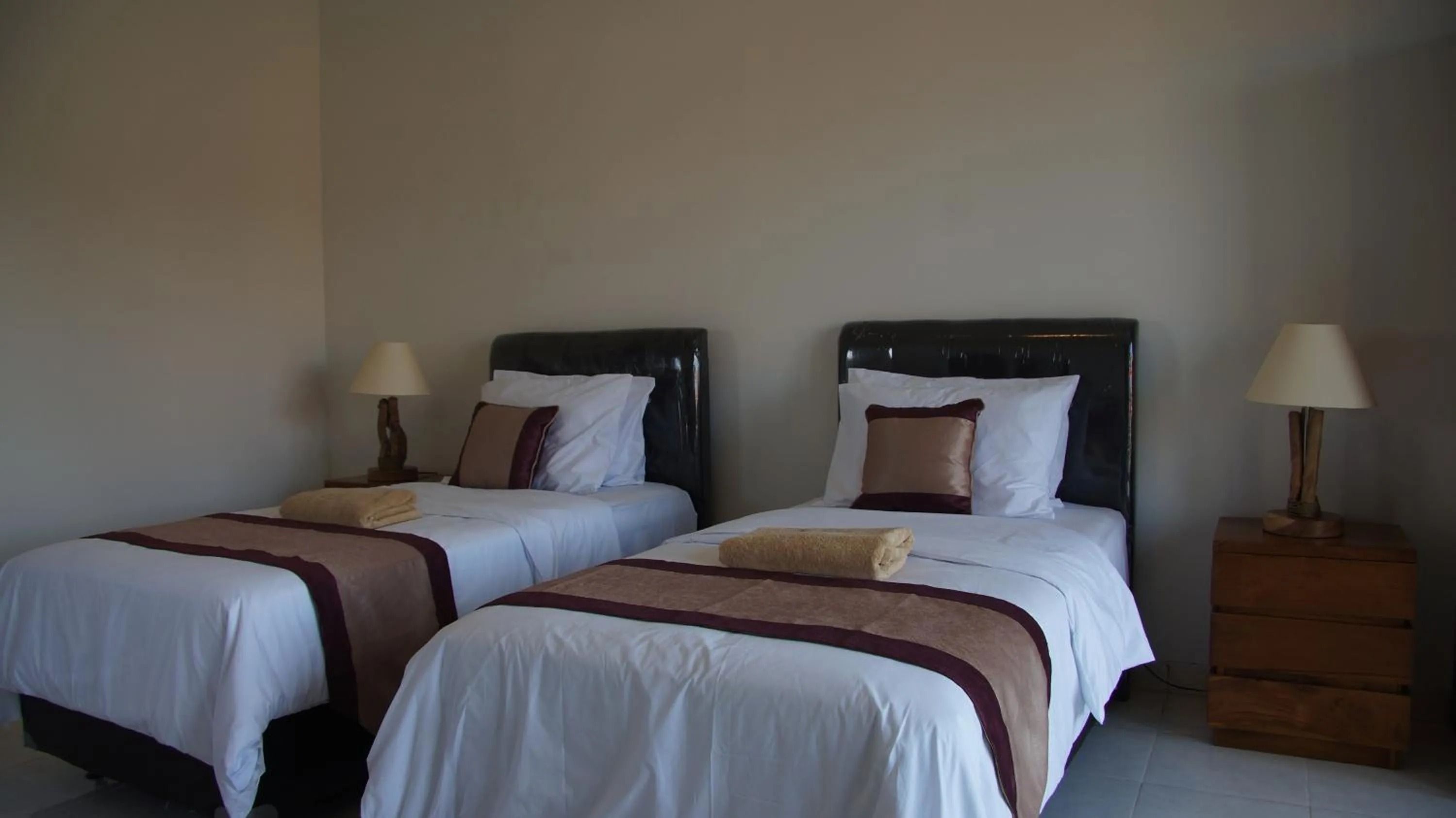 Bed in Surya Guest House Sanur