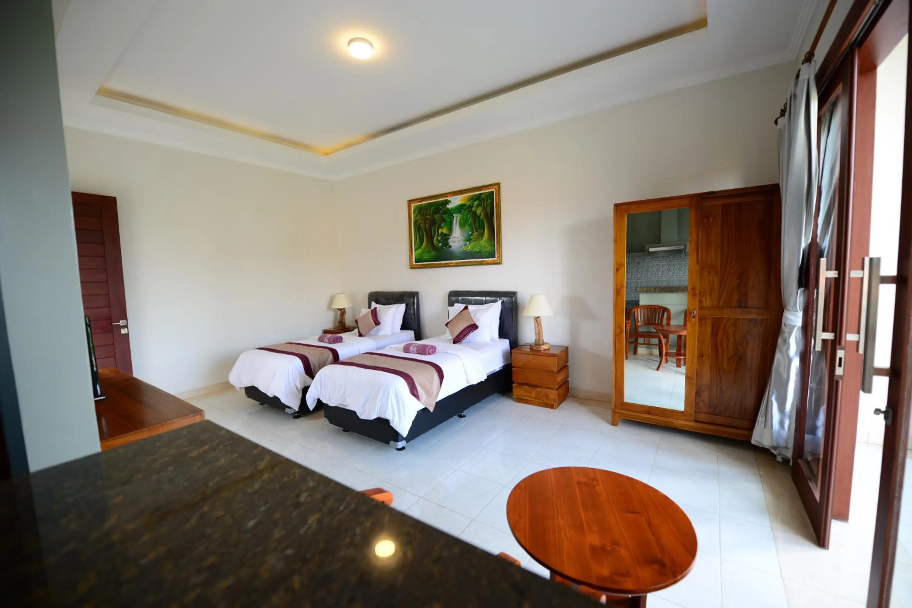 Bed in Surya Guest House Sanur