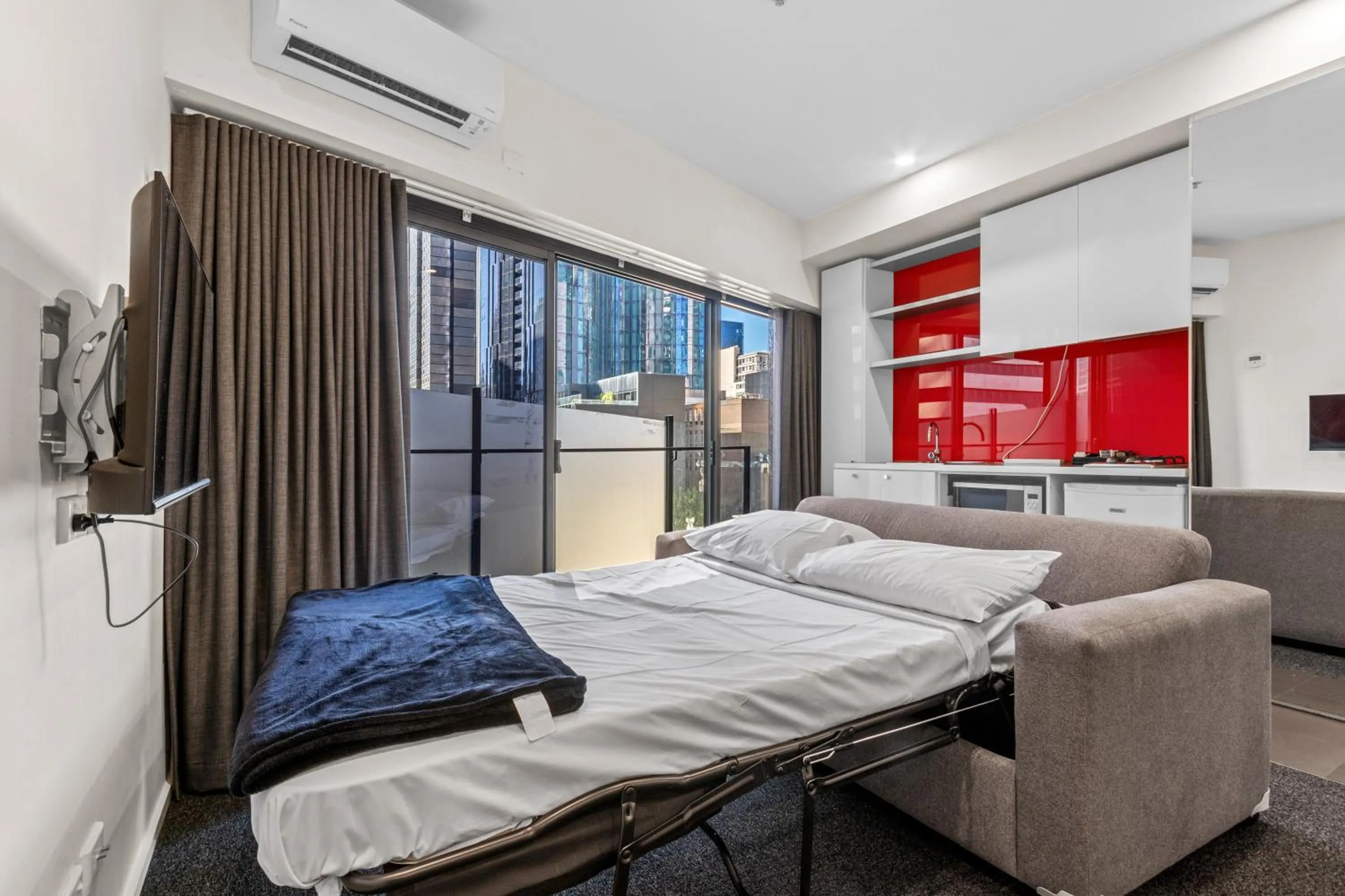 Bed in Comfort Apartments on Elizabeth