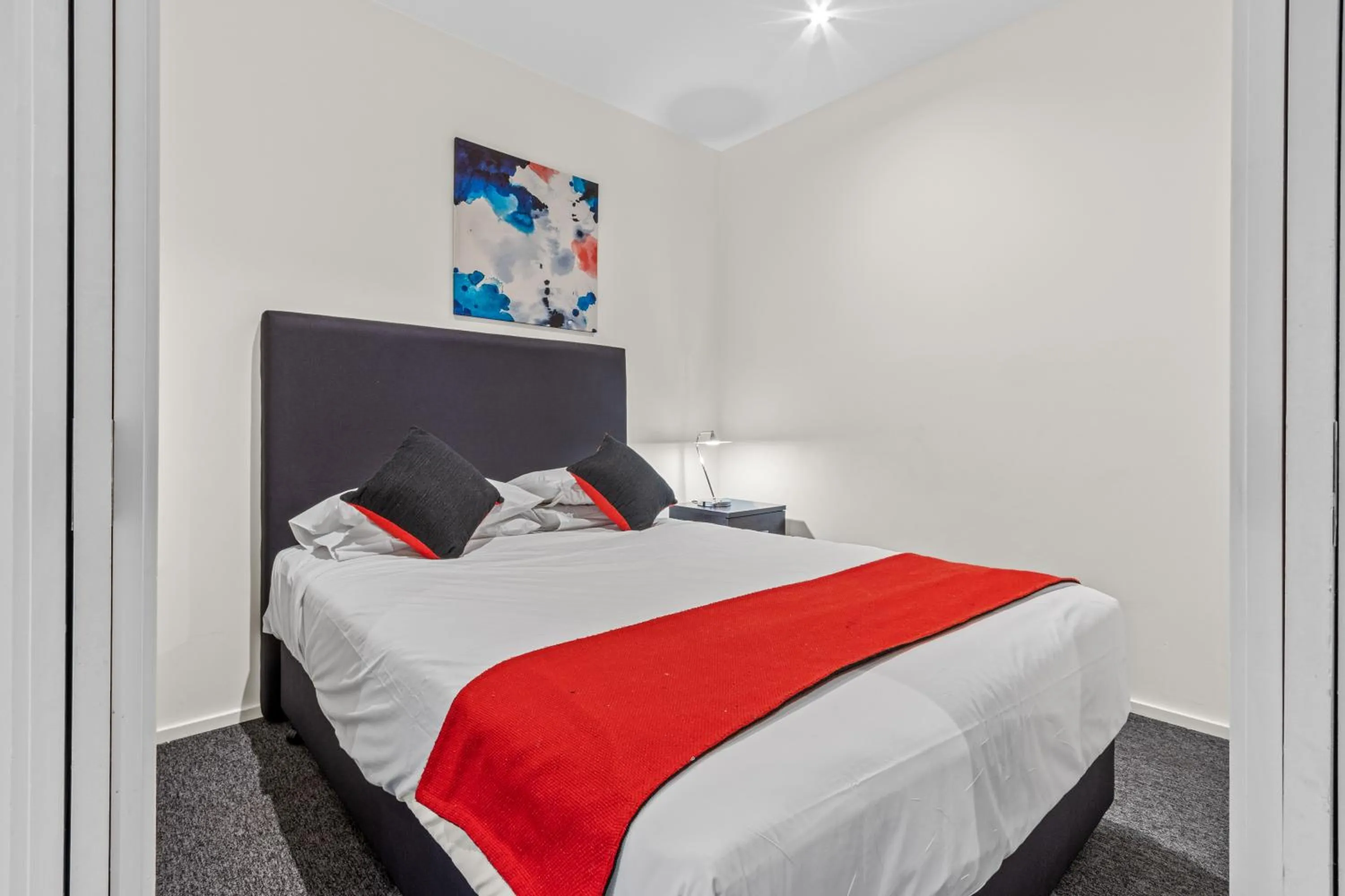 Bed in Comfort Apartments on Elizabeth