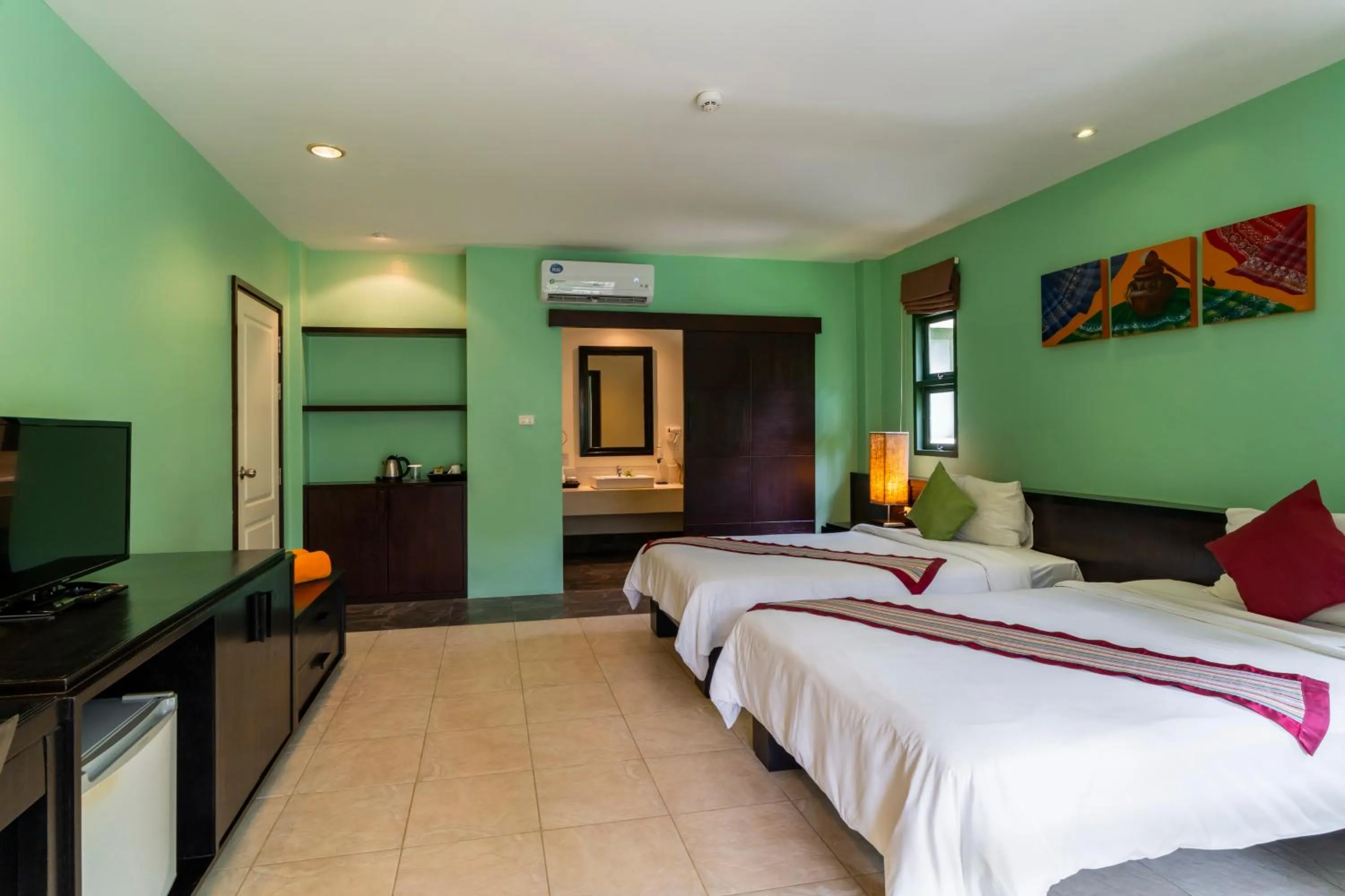 Bed in Baan Khaolak Beach Resort