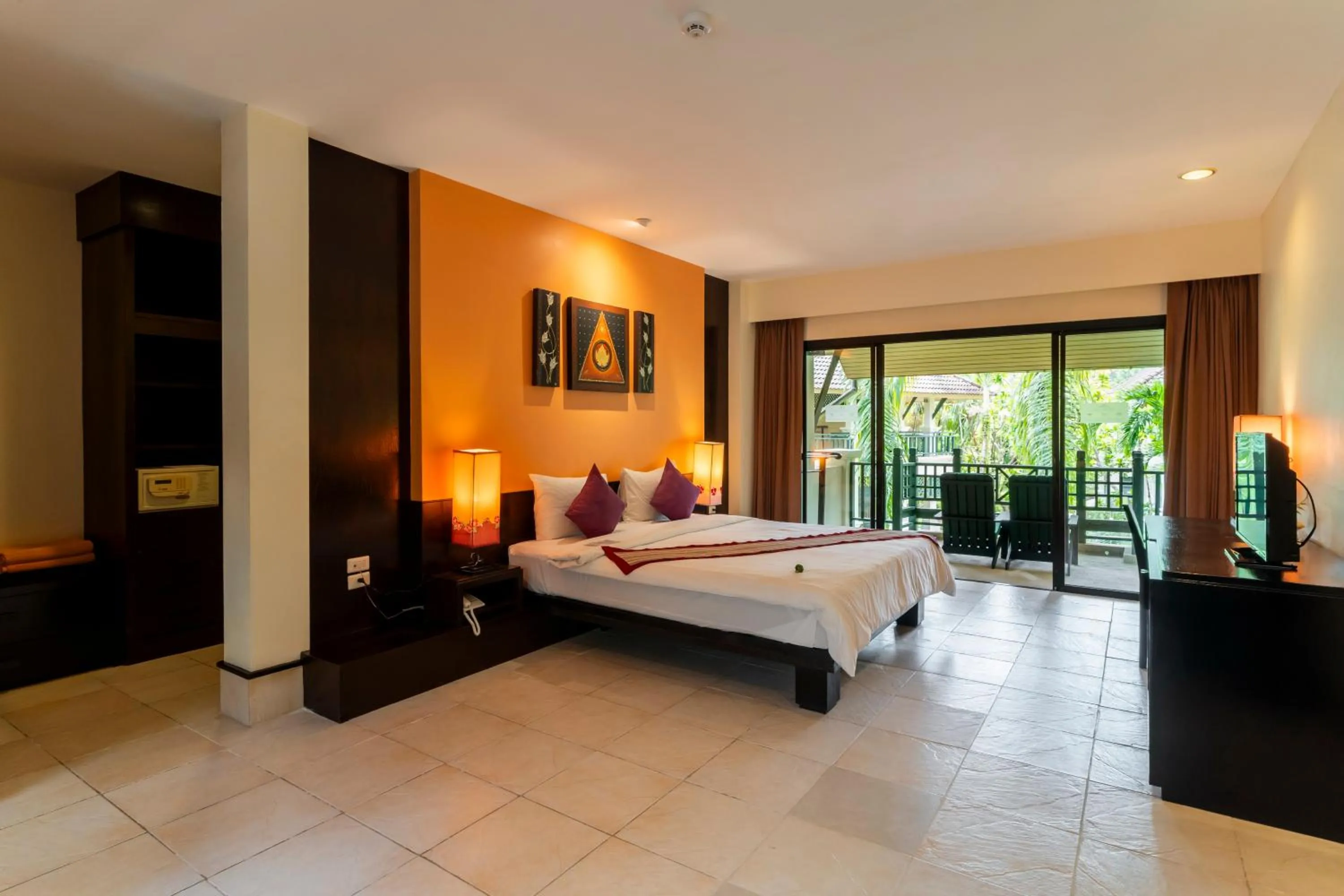 Bed in Baan Khaolak Beach Resort