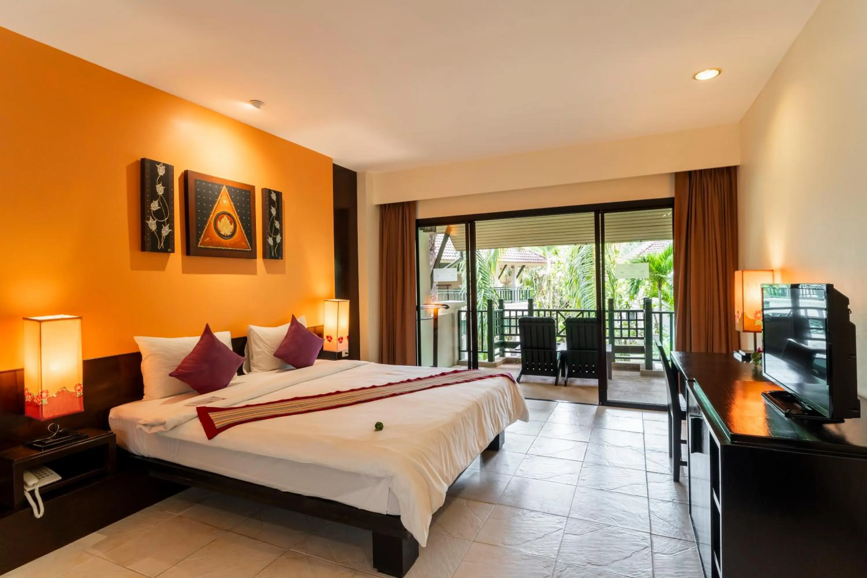 Bed in Baan Khaolak Beach Resort