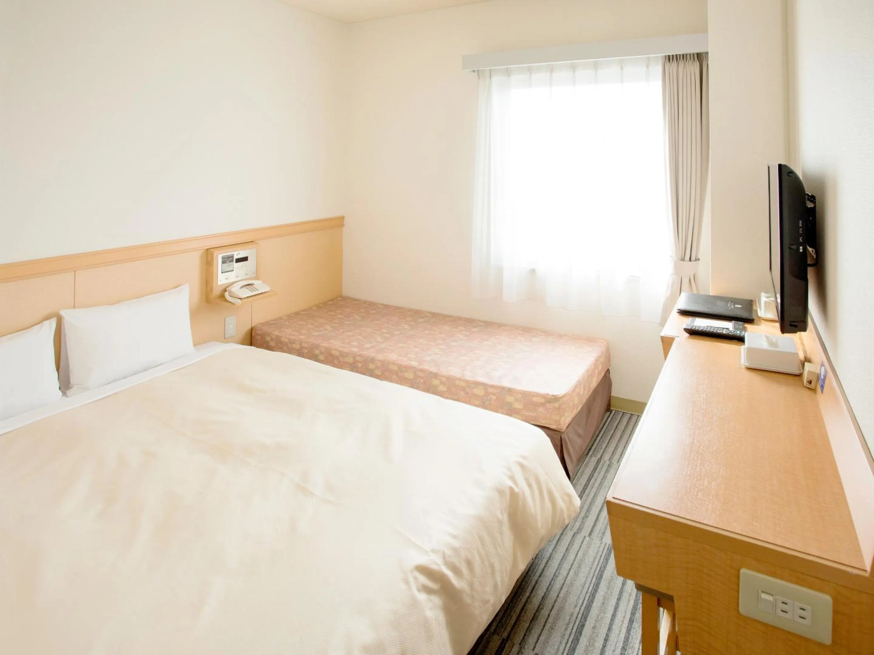 Bed in Toko City Hotel Matsumoto