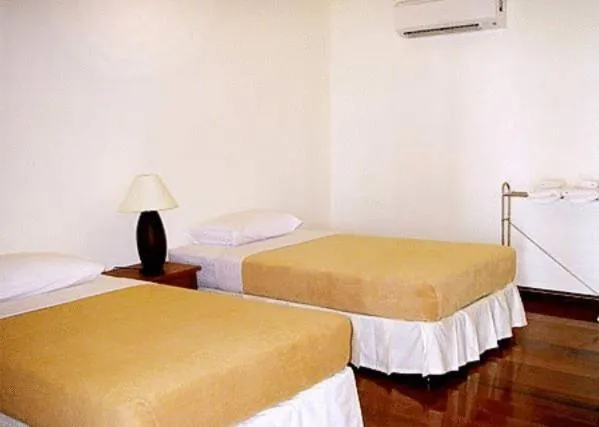 Bed in Baan Klang Aow Beach Resort