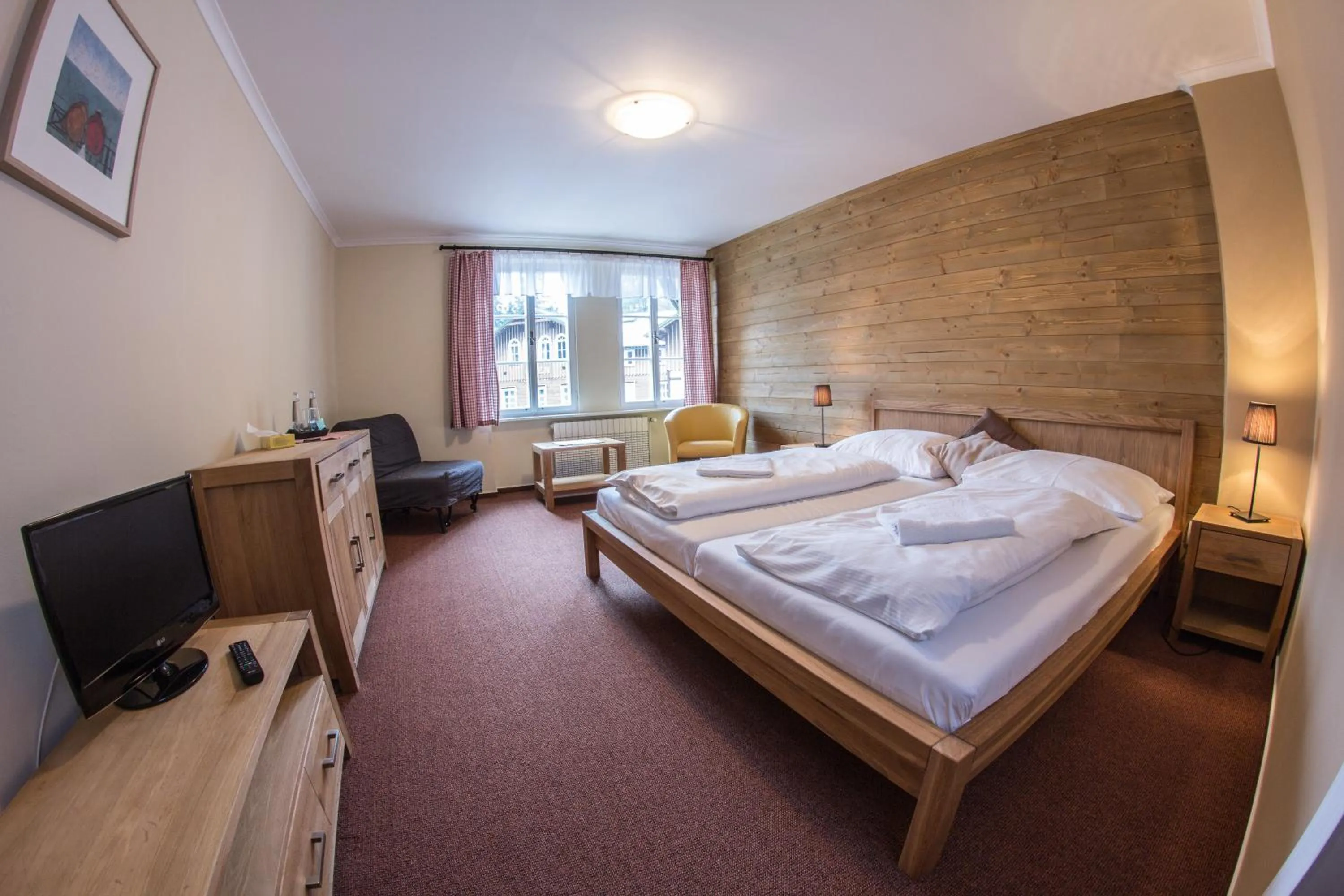 Living room, Bed in Hotel Erika