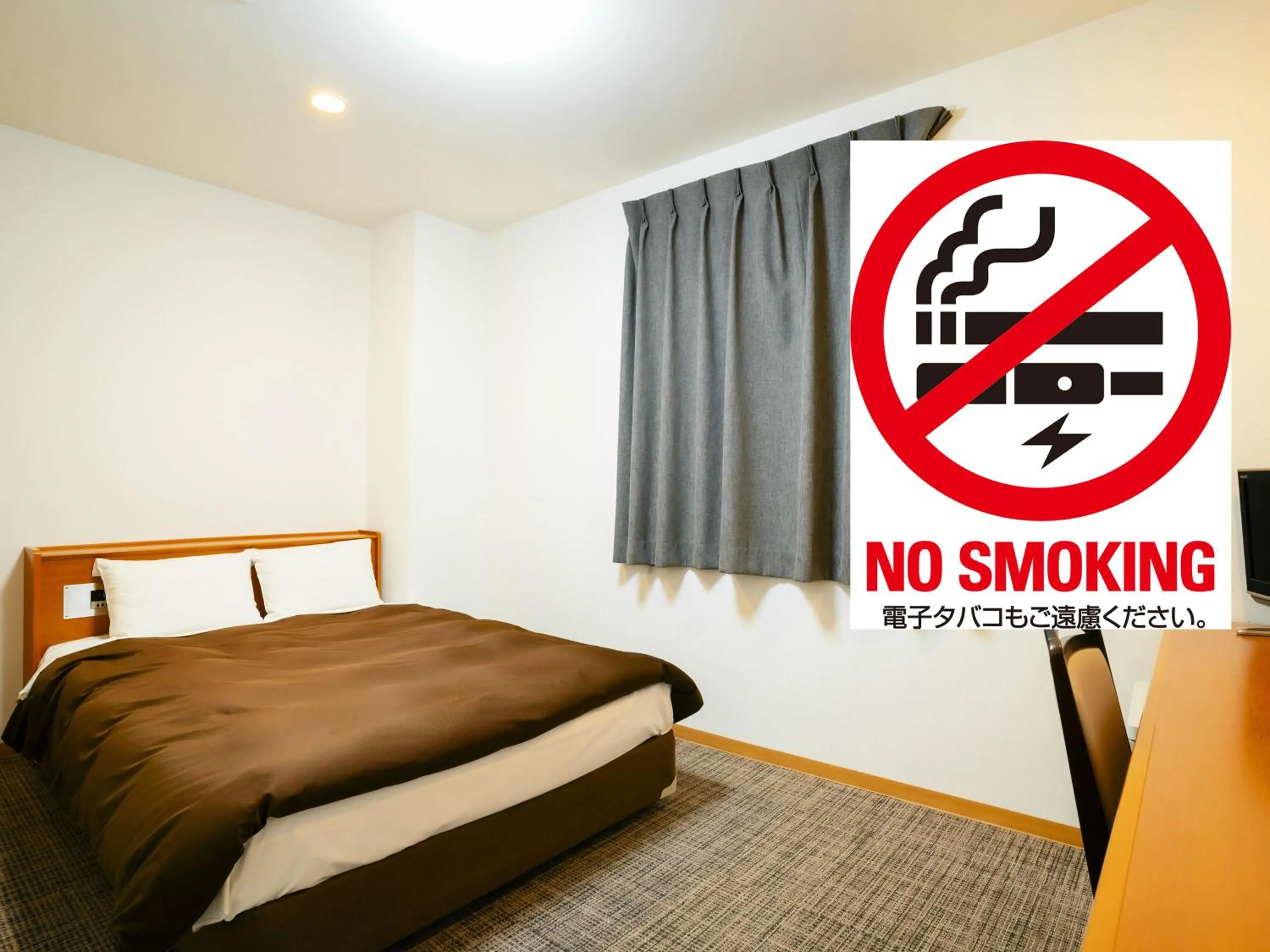 Bed in Kumamoto Ichibamae Business Kurenai Hotel