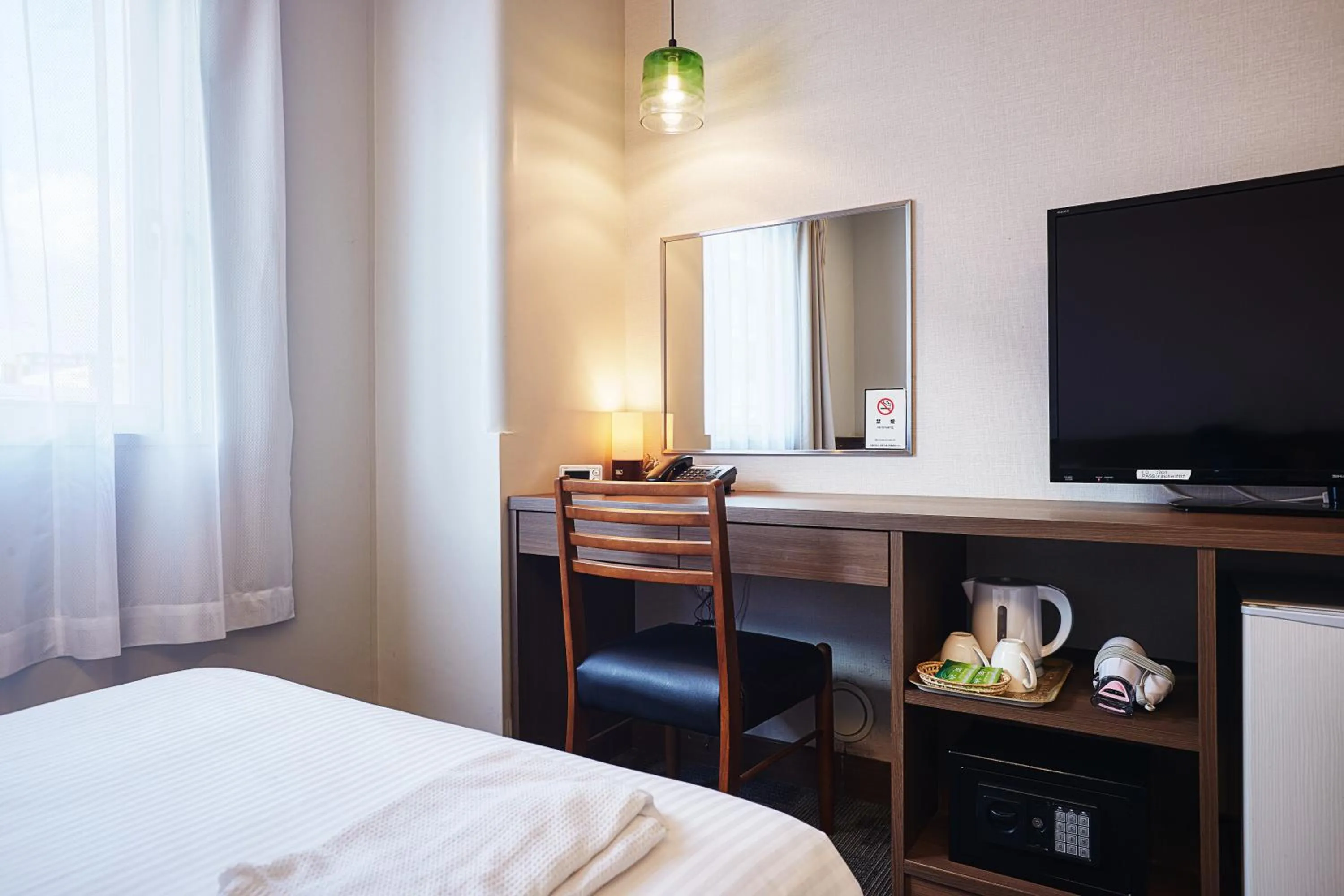 Bed in RJ Hotel Naha