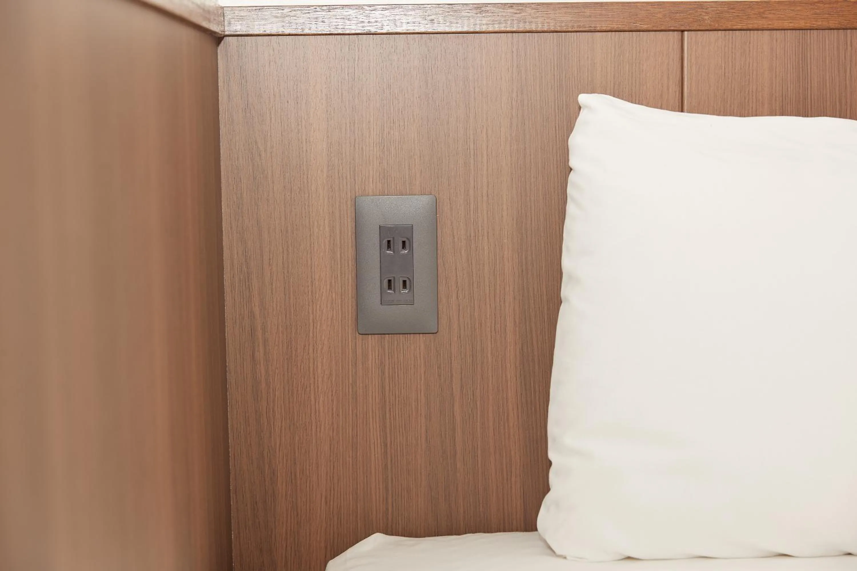 Bed in RJ Hotel Naha