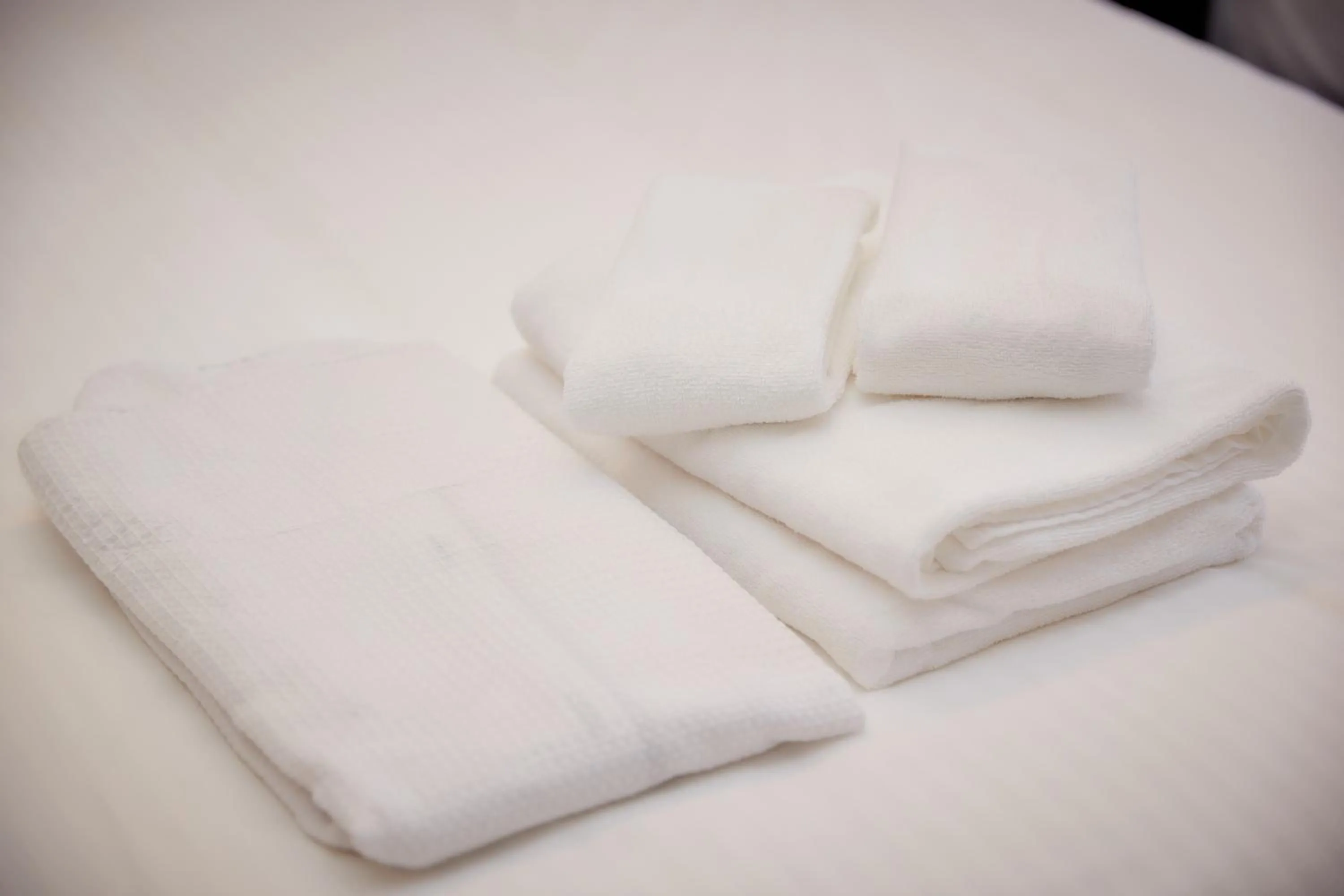 towels, Bed in RJ Hotel Naha