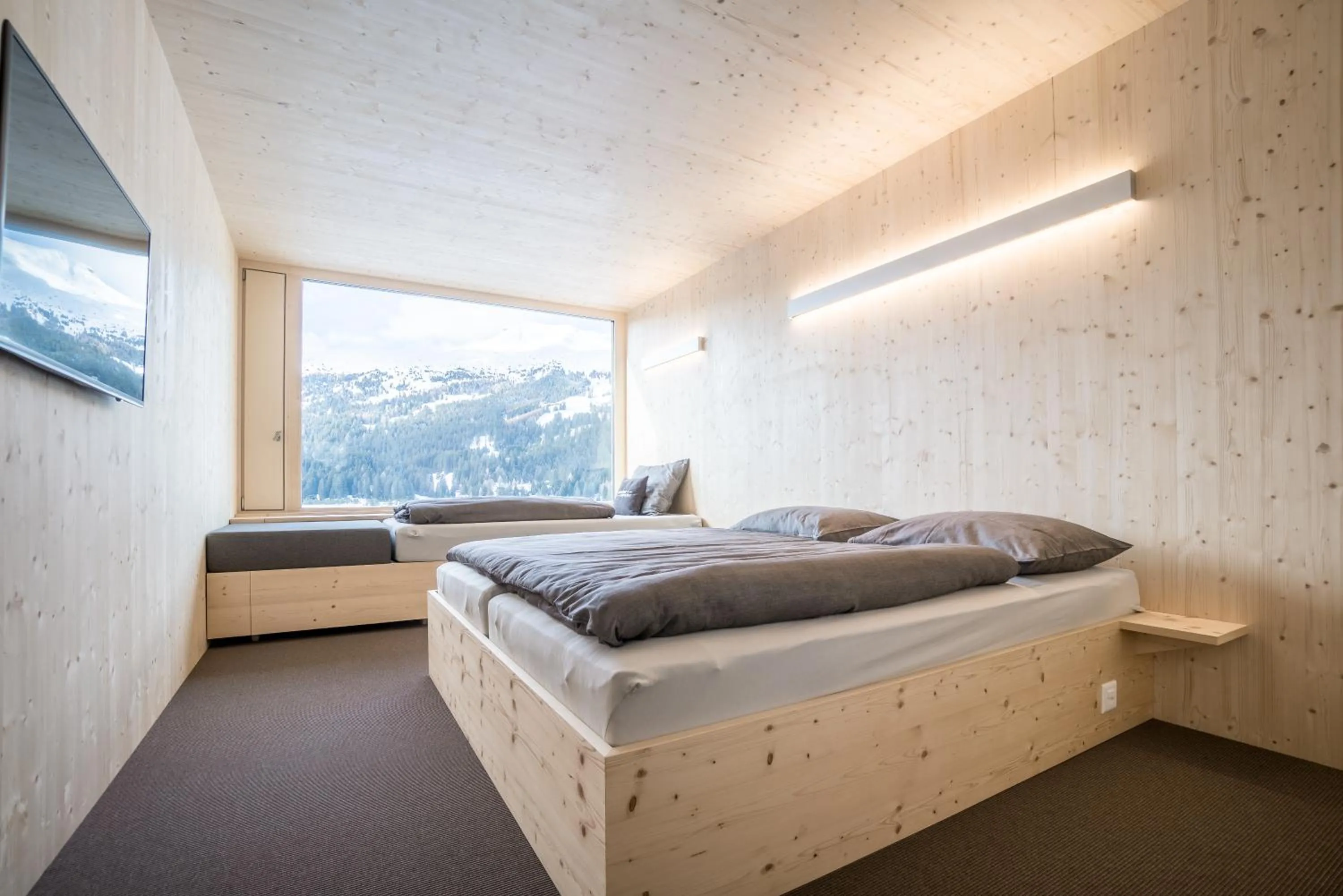 Photo of the whole room, Bed in Revier Mountain Lodge Lenzerheide
