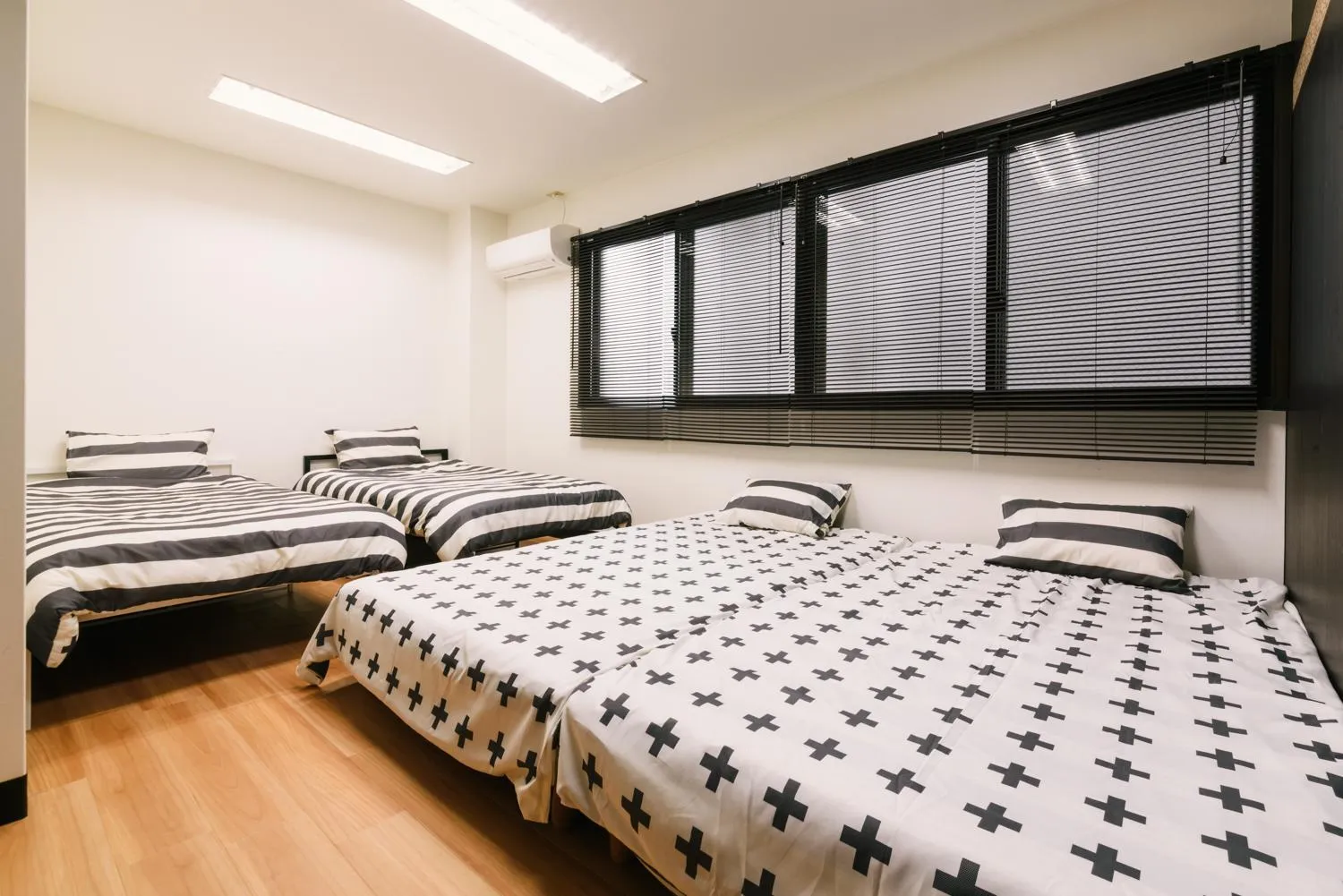 Bed in Guest House Yasuragi Hakataekimae