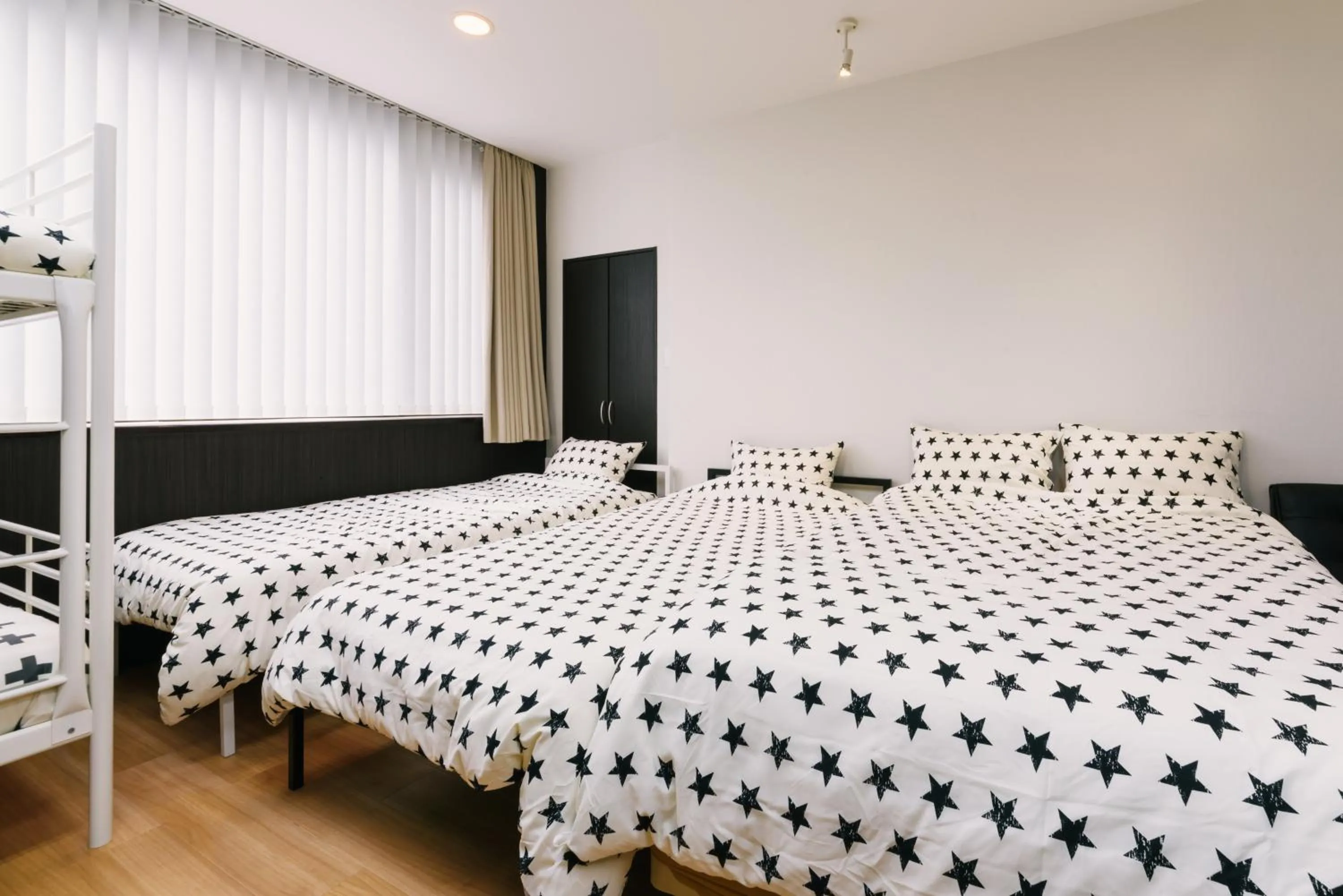 Bed in Guest House Yasuragi Hakataekimae