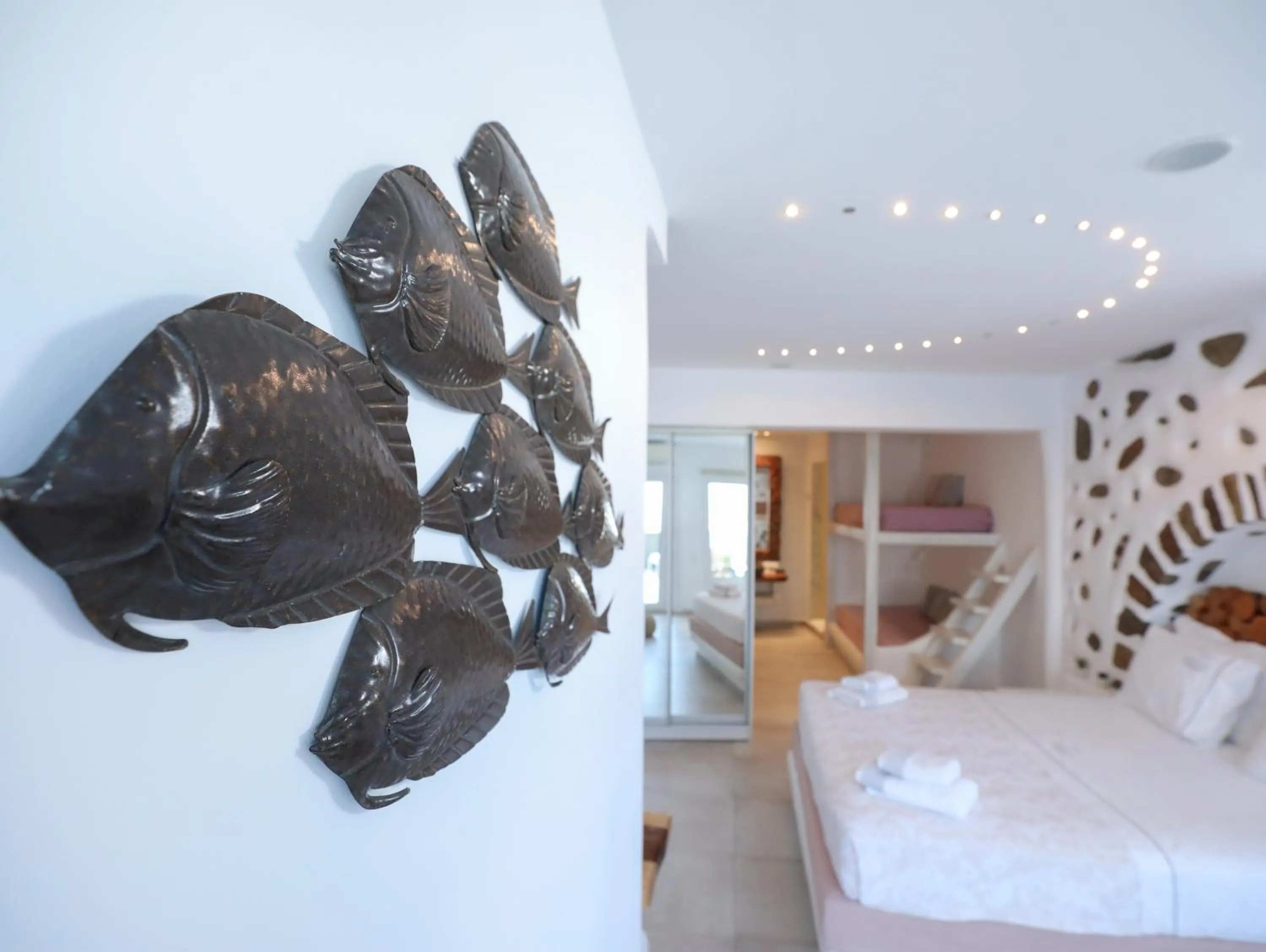 Photo of the whole room, Bed in Ibiscus Boutique