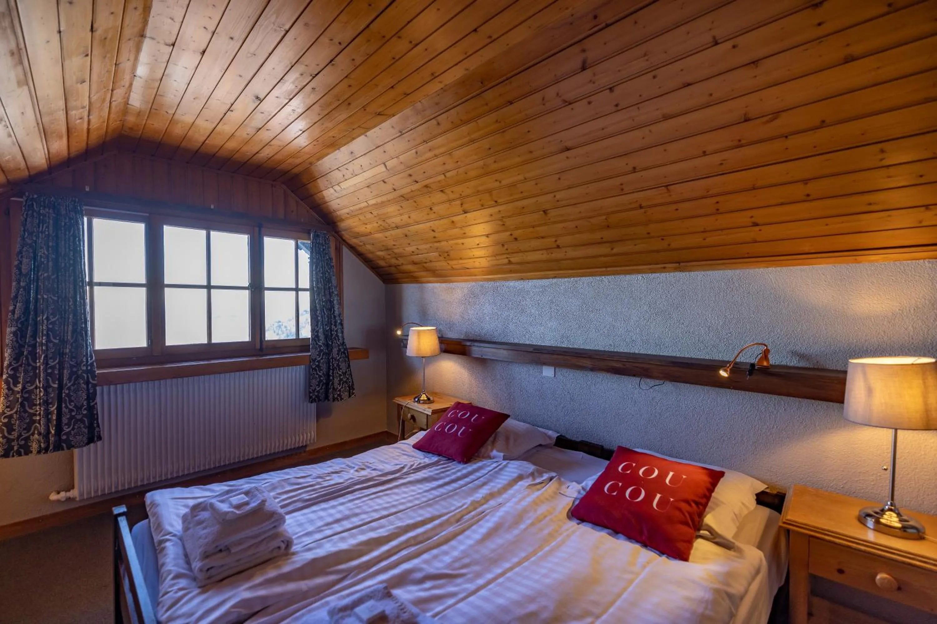 Bed in Le Coucou Hotel Restaurant & Lounge-Bar