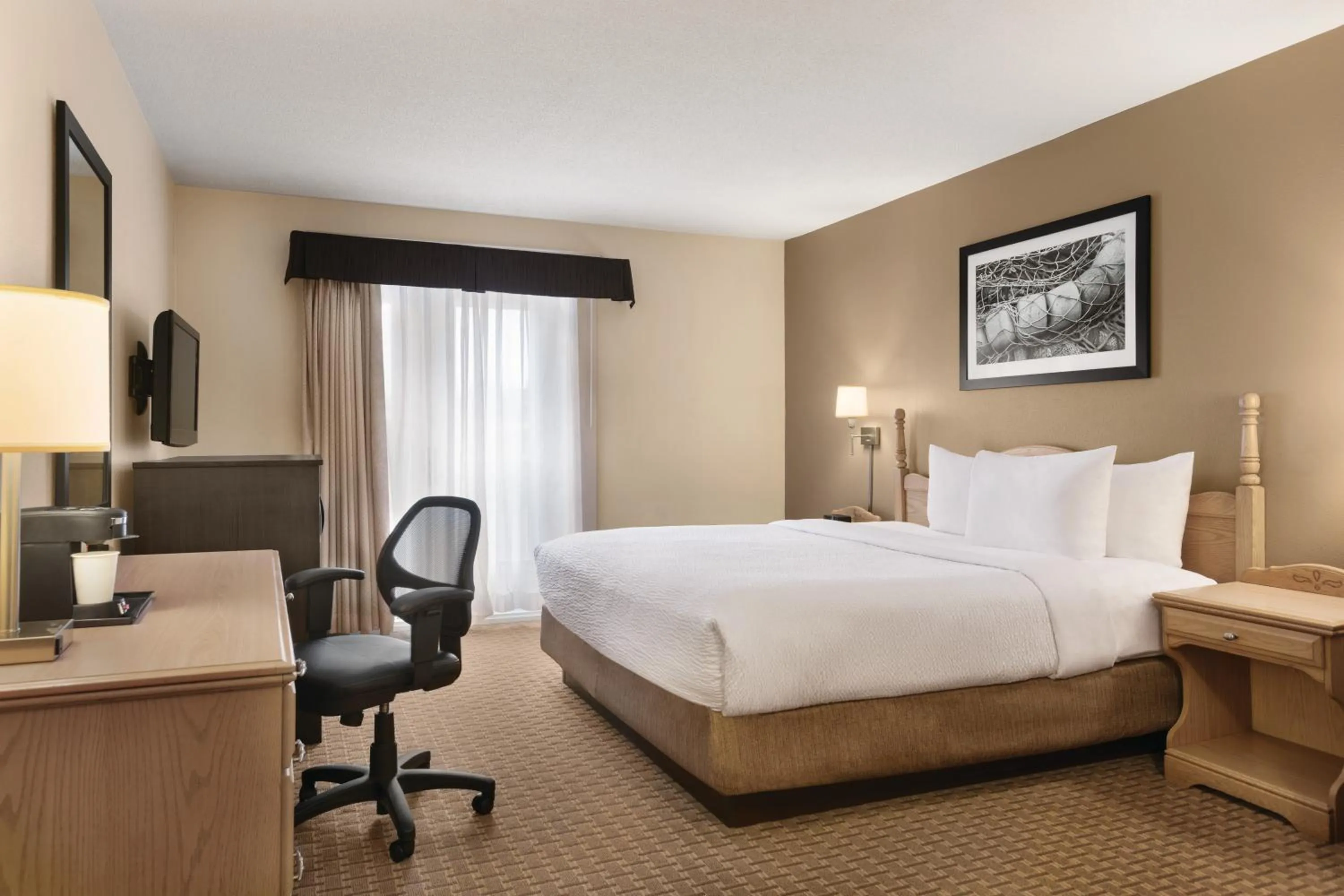 Bed in Travelodge Suites by Wyndham Moncton