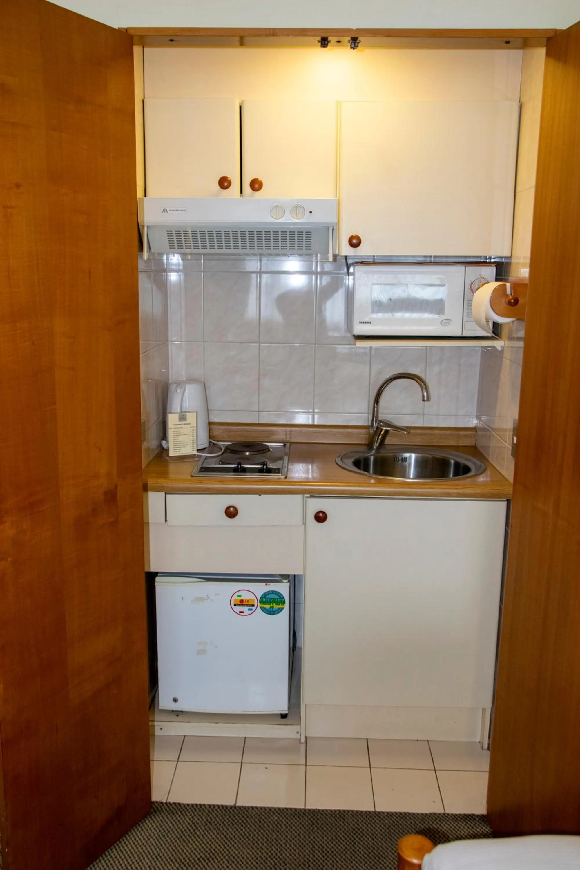 Kitchen or kitchenette in abba Presidente Suites Puerto Montt