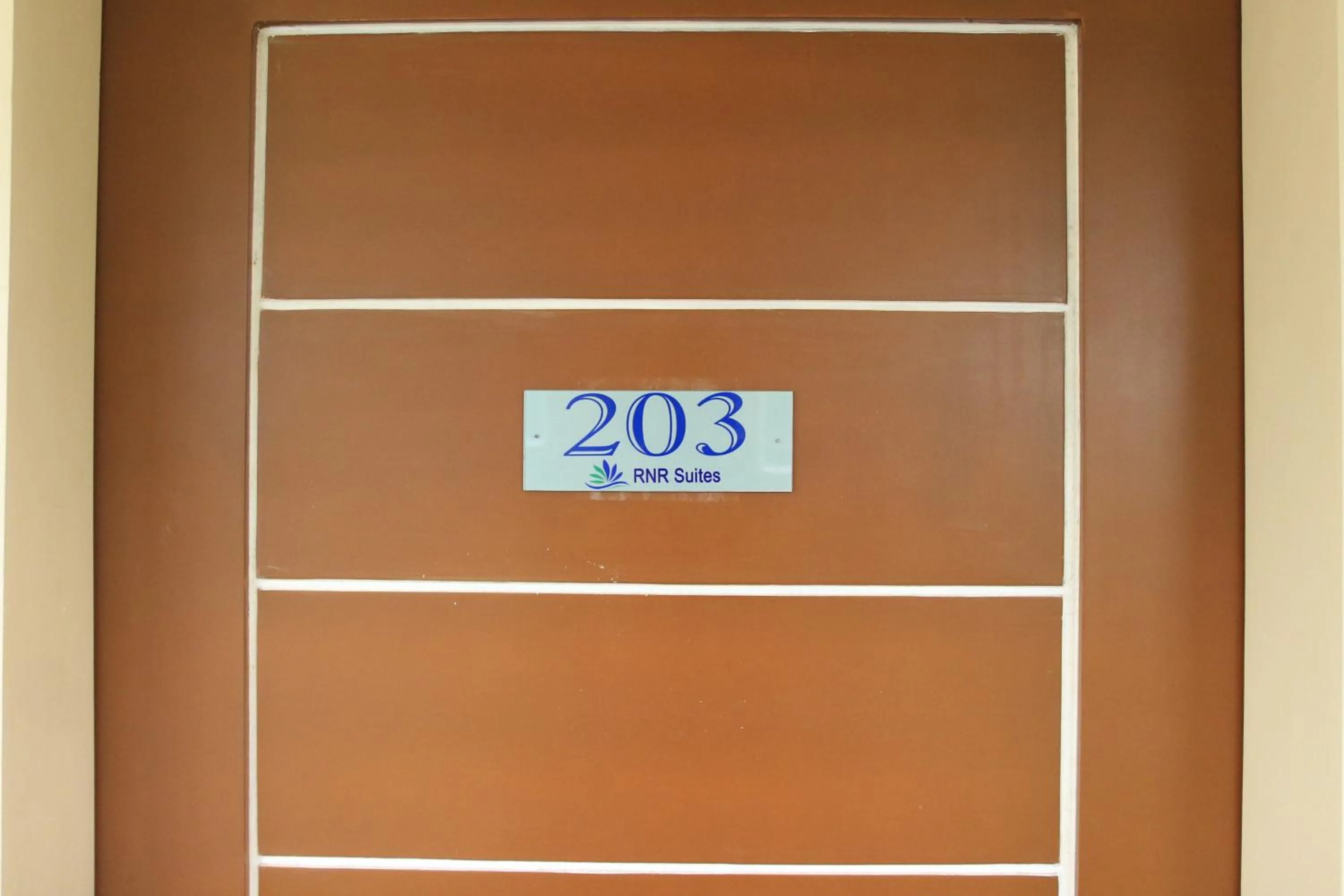 Property logo or sign in RNR Suites