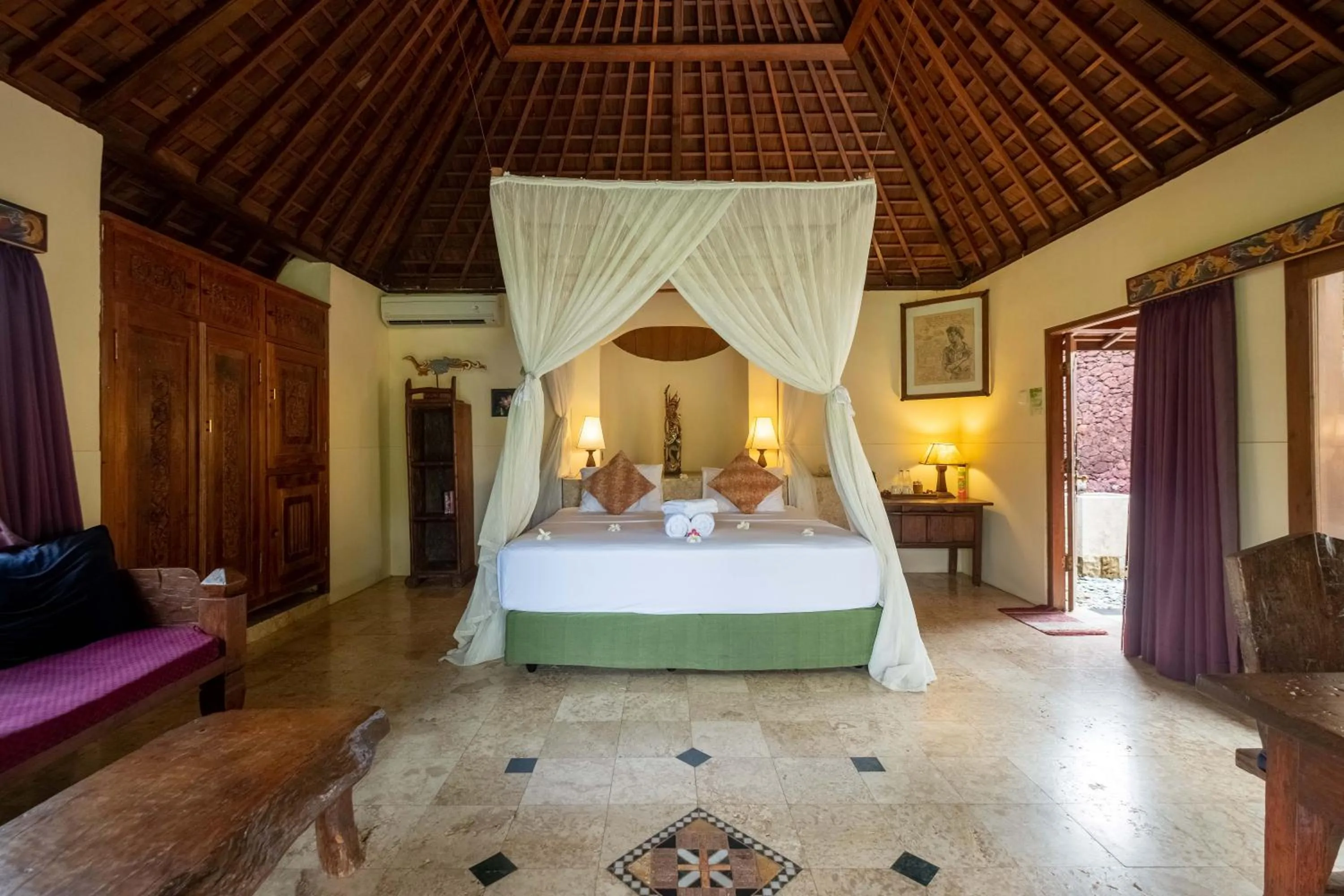 Bed in Taman Sari Bali Resort and Spa