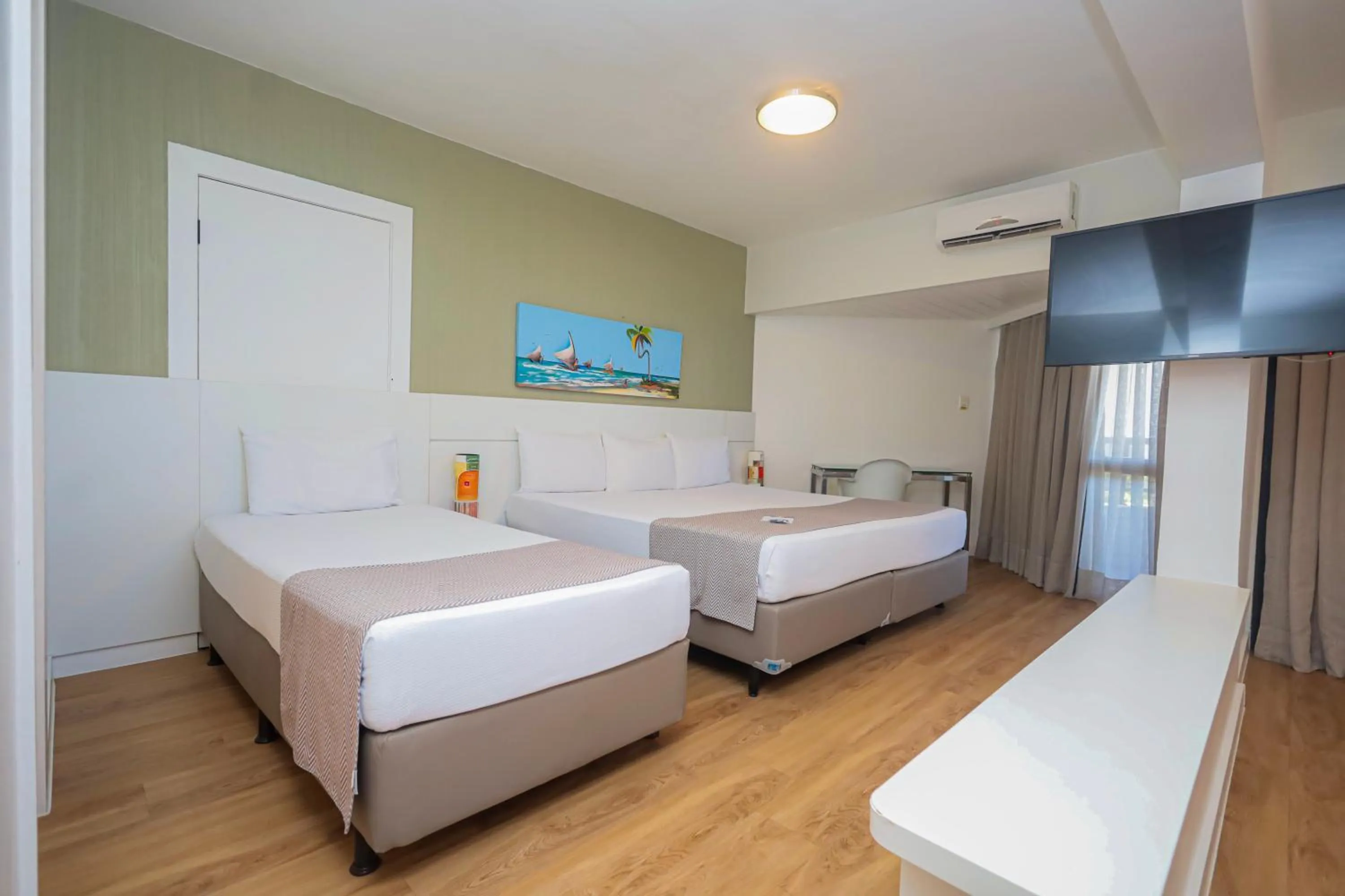 Bed in Maceió Atlantic Suites