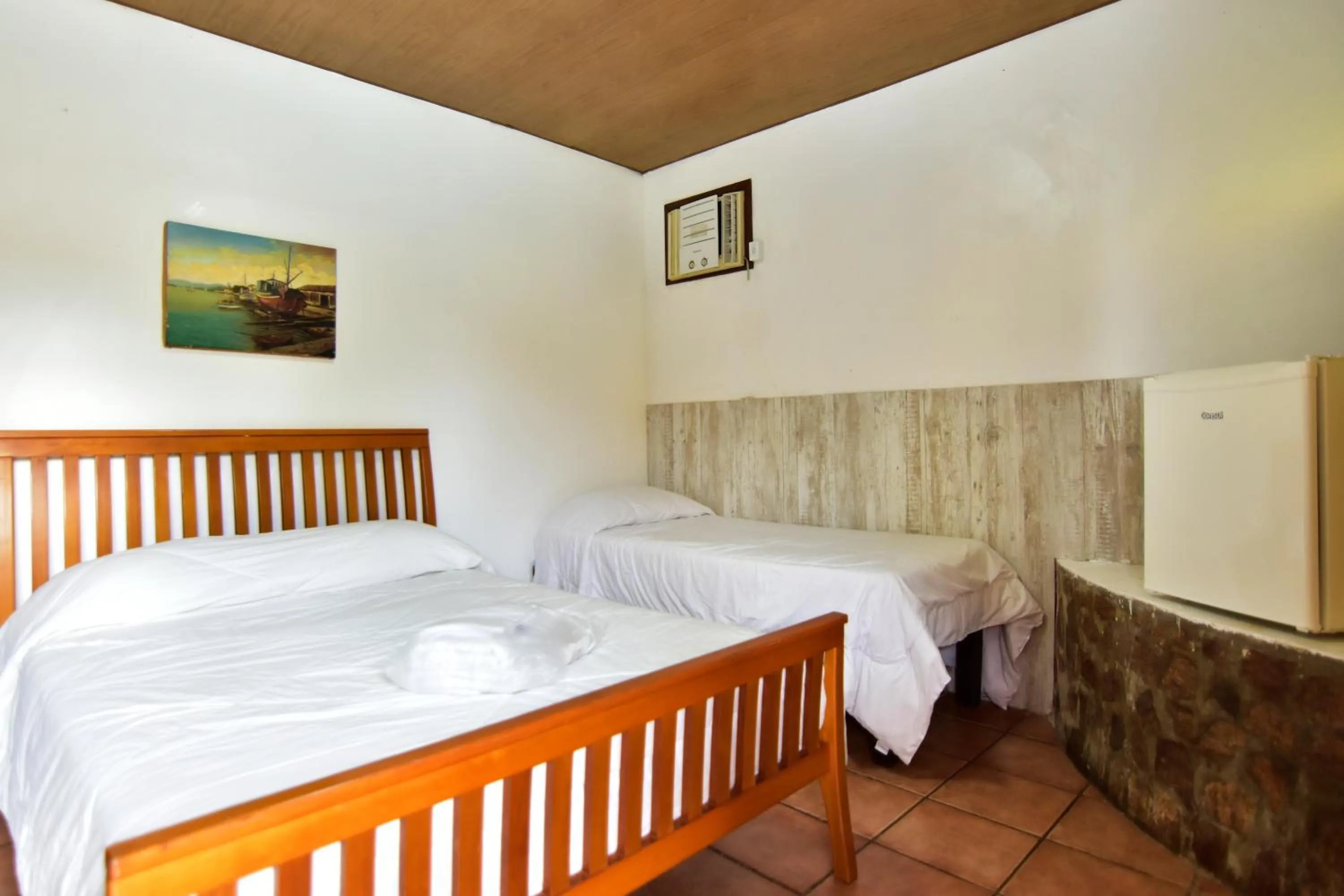 Bed in Pousada Tanto Mar