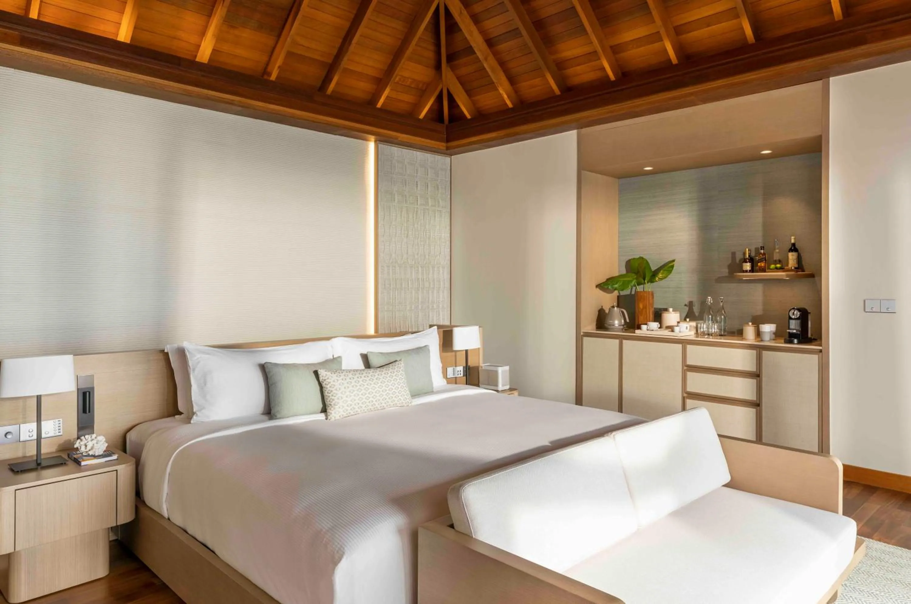 Seating area, Bed in Huvafen Fushi Maldives