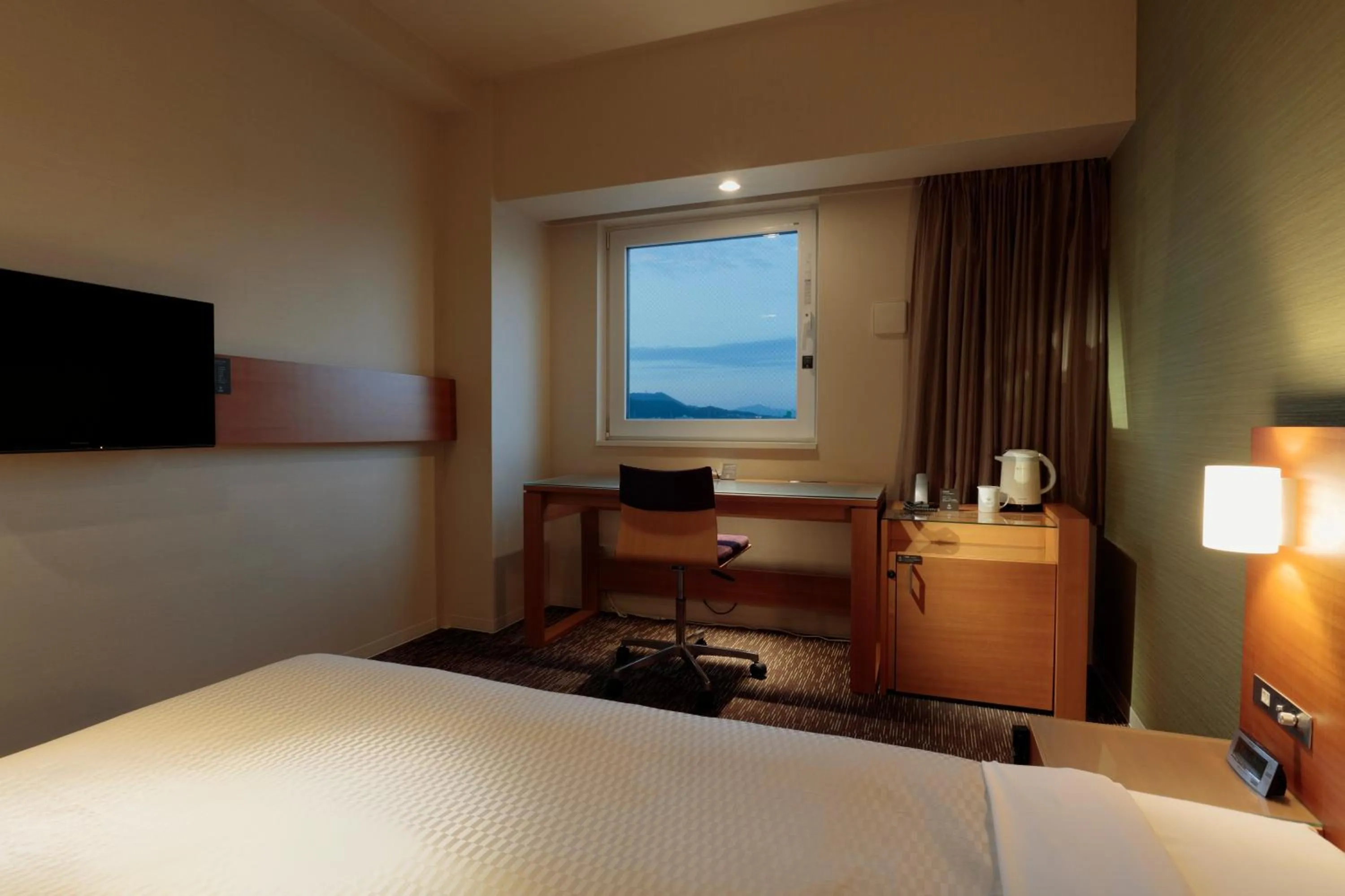 Photo of the whole room, Bed in Candeo Hotels Fukuyama