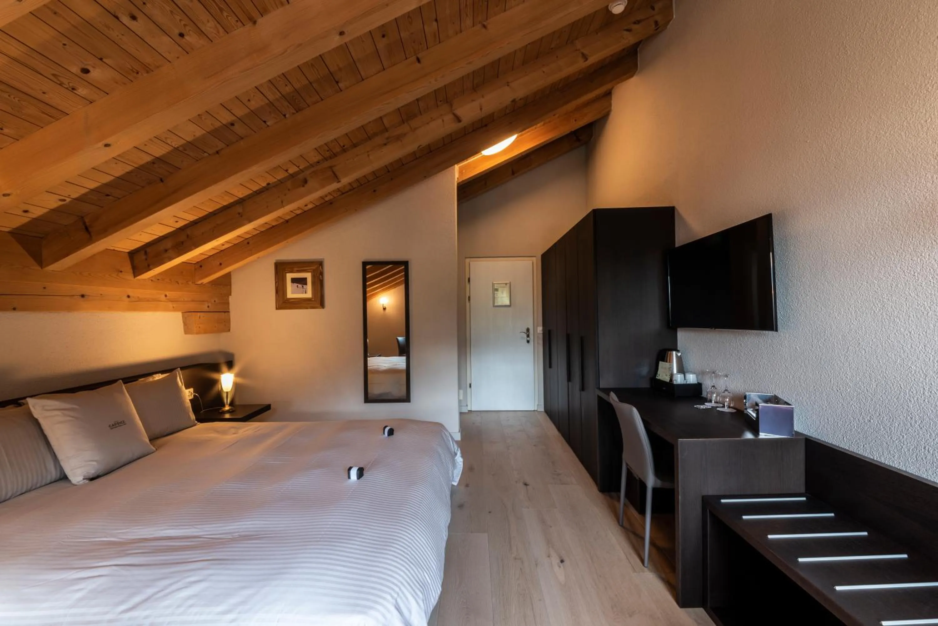 Bed in Hotel Maya Caprice