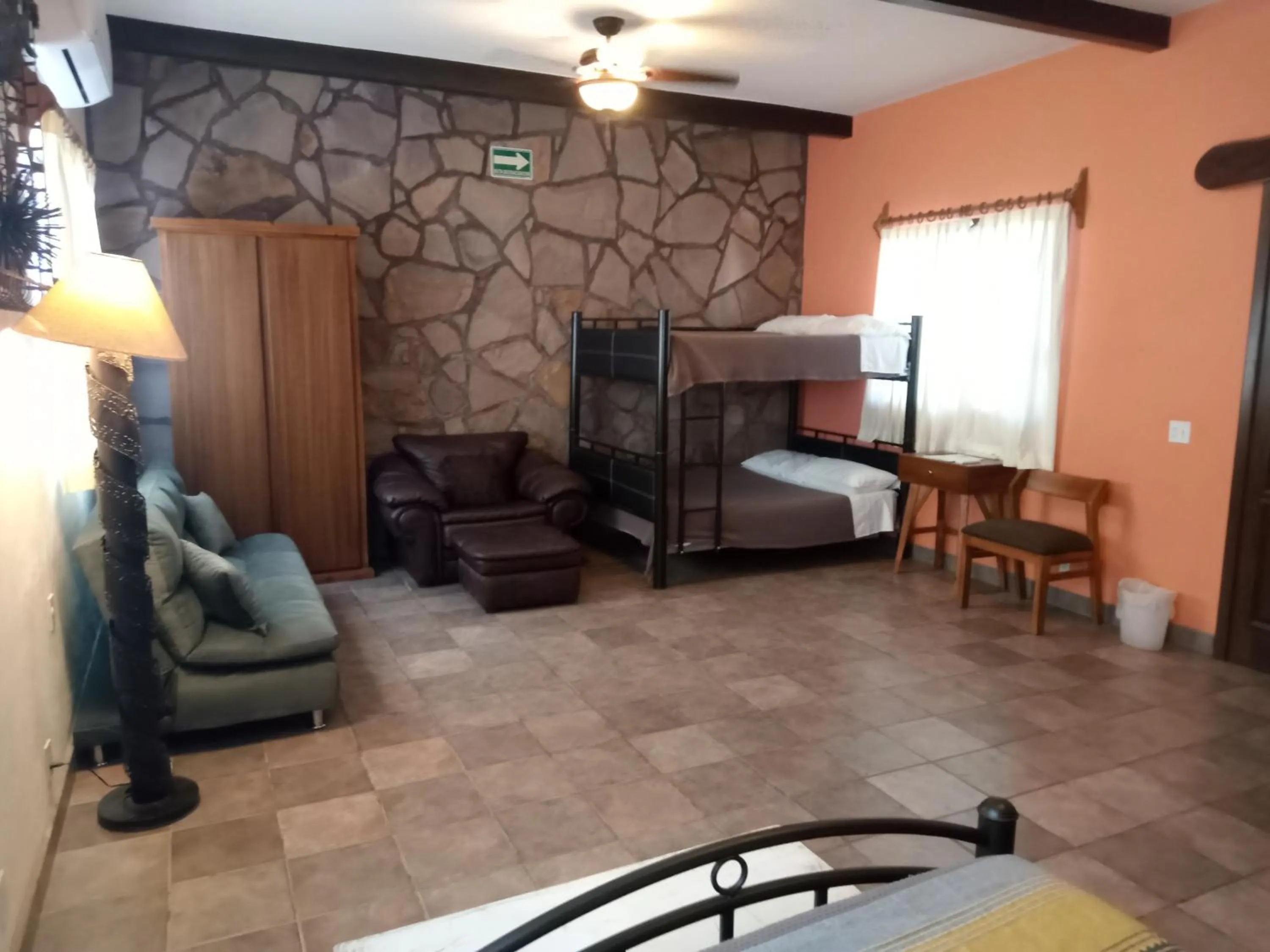 Seating area, Bed in Hacienda De Palmas