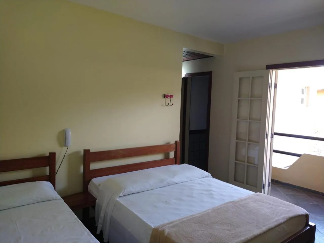 Bed in Pousada Genesis