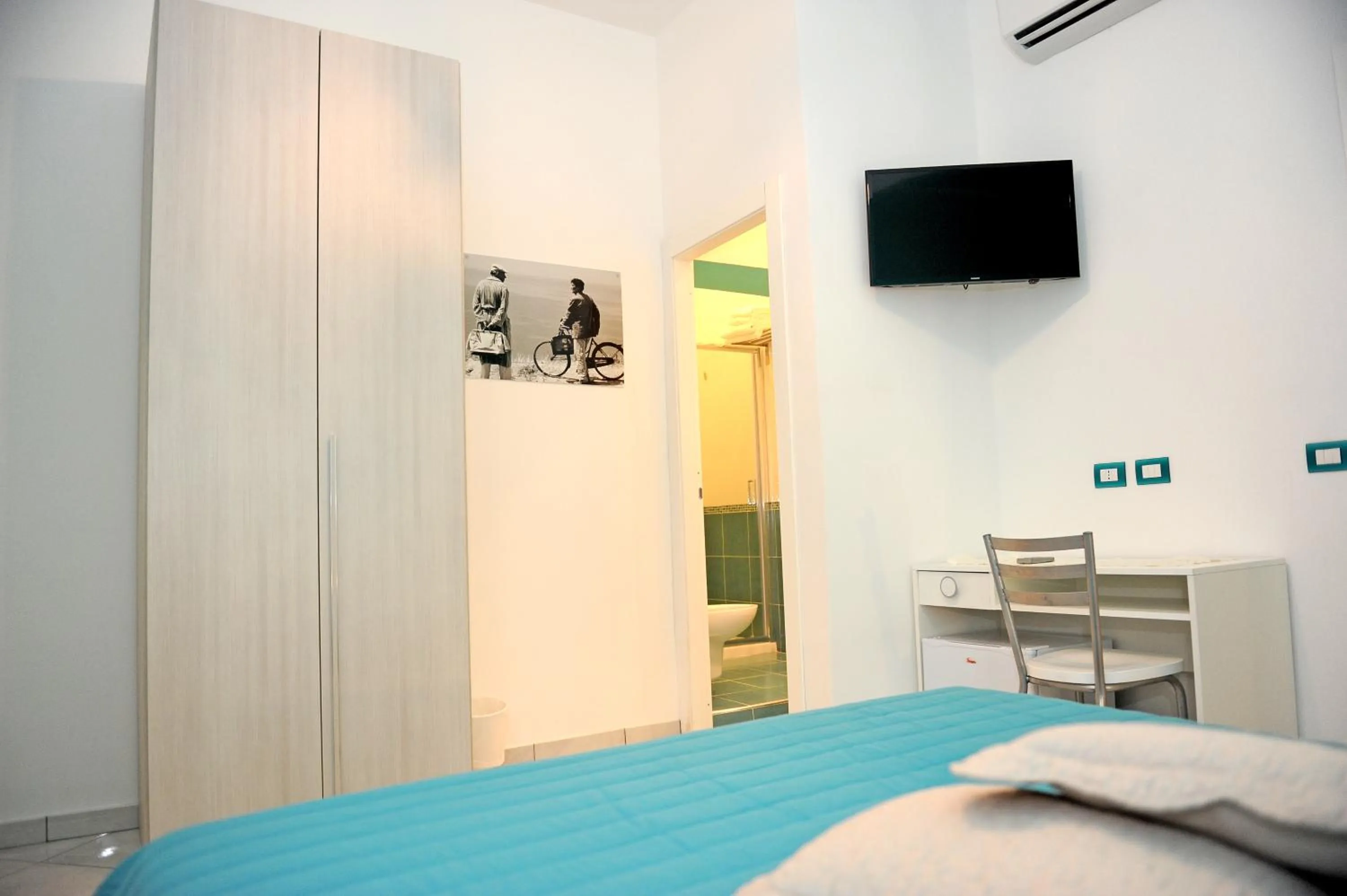 Bedroom in L'Isola Del Postino Rooms