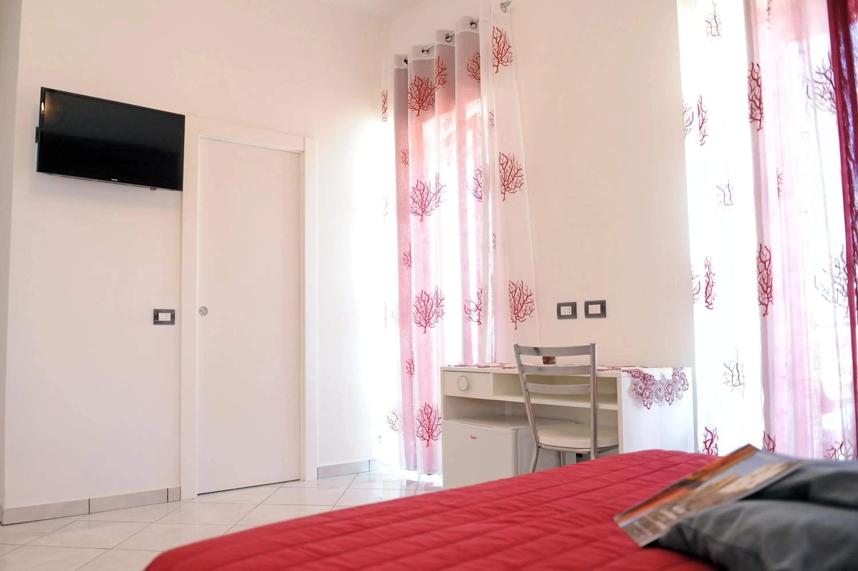 Bed in L'Isola Del Postino Rooms