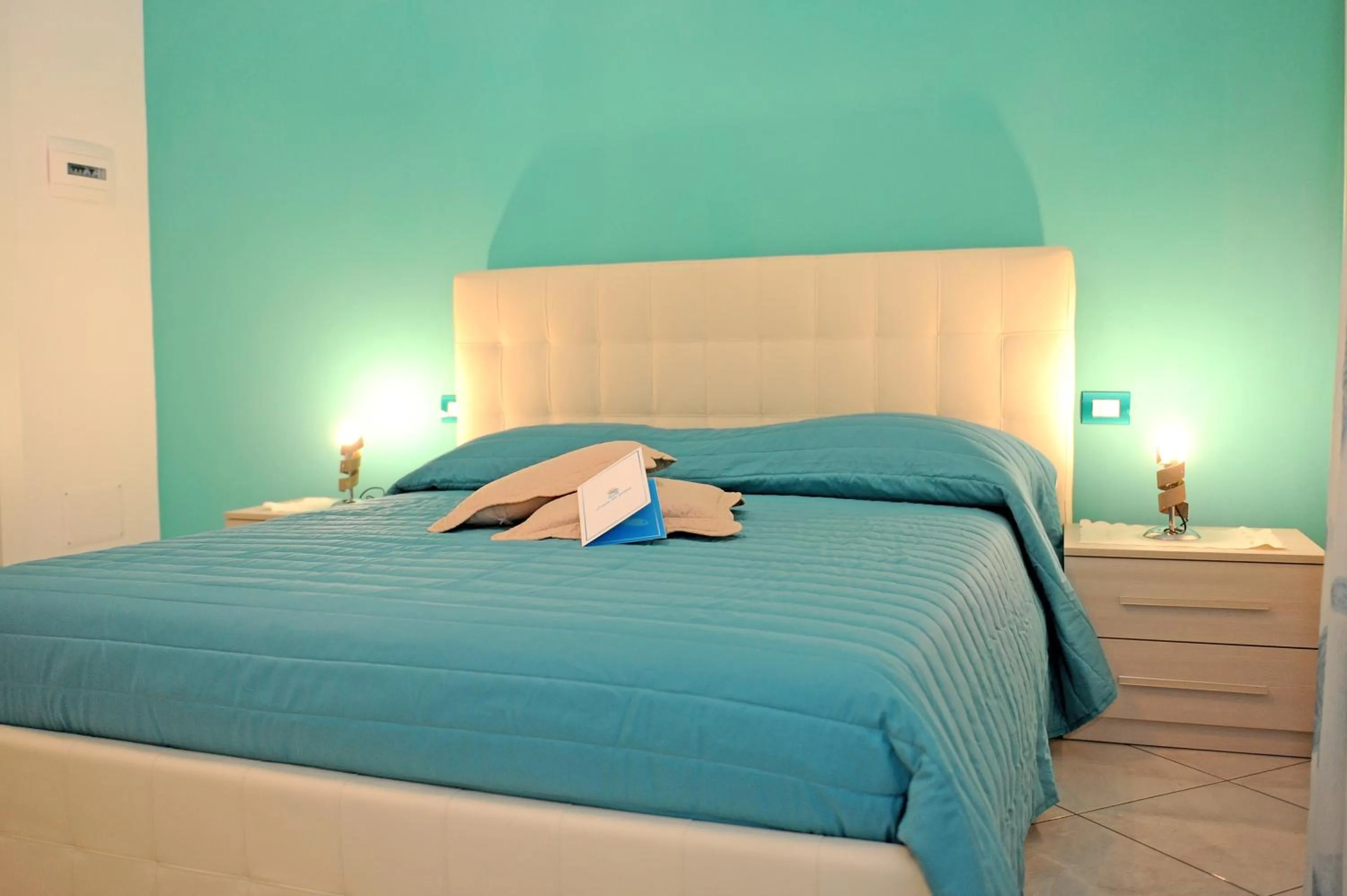 Bed in L'Isola Del Postino Rooms