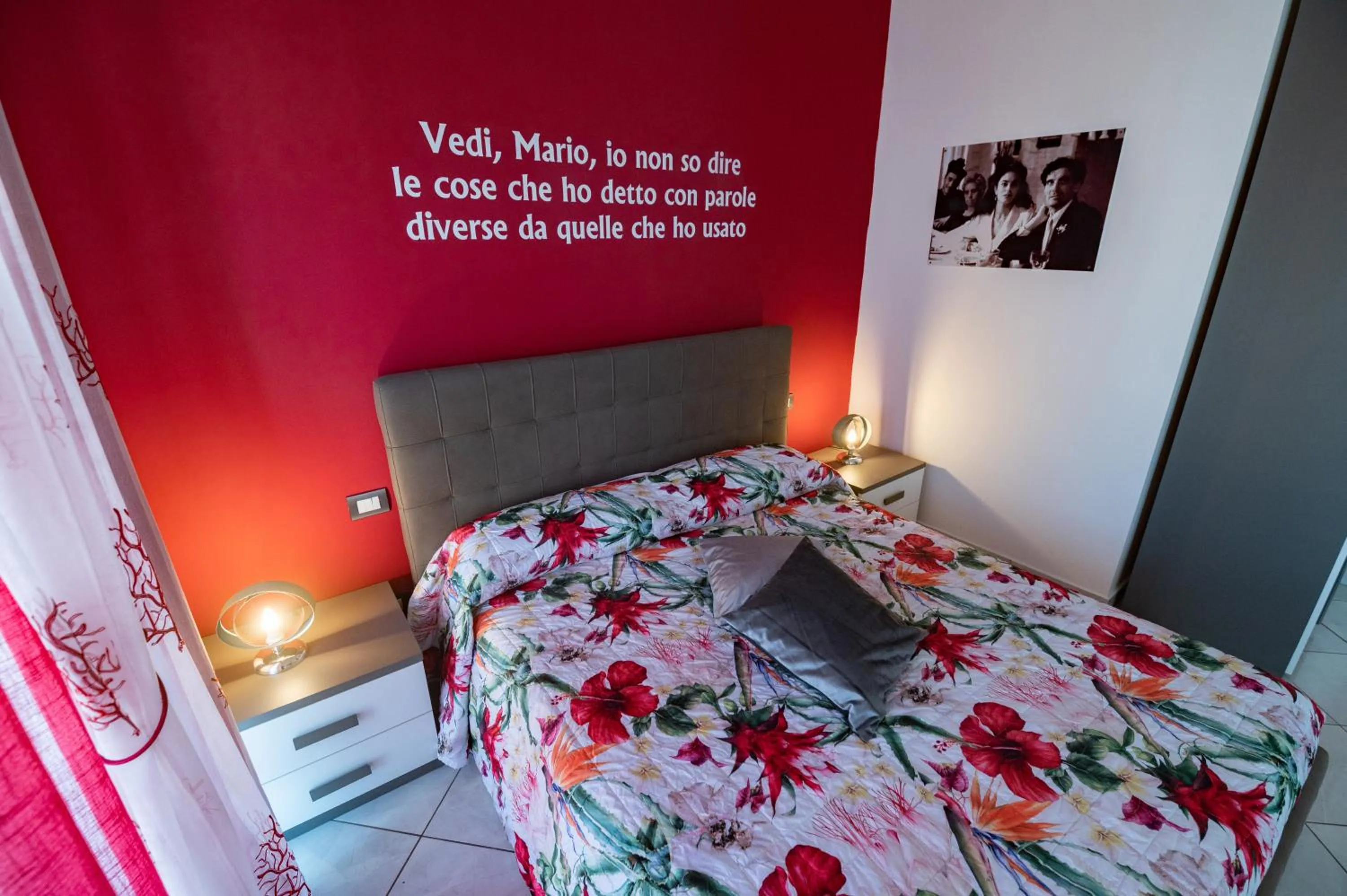 Bed in L'Isola Del Postino Rooms