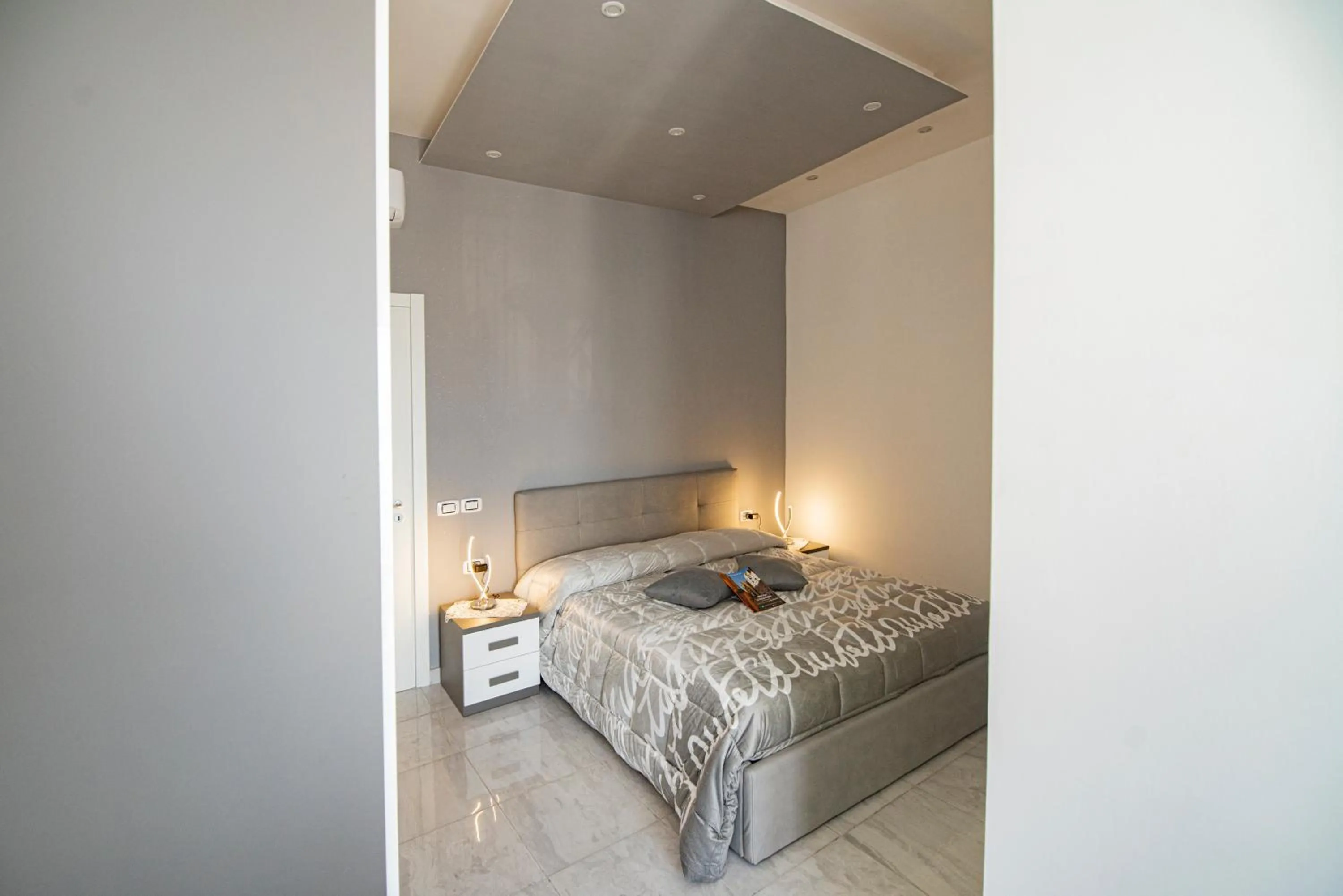 Bed in L'Isola Del Postino Rooms