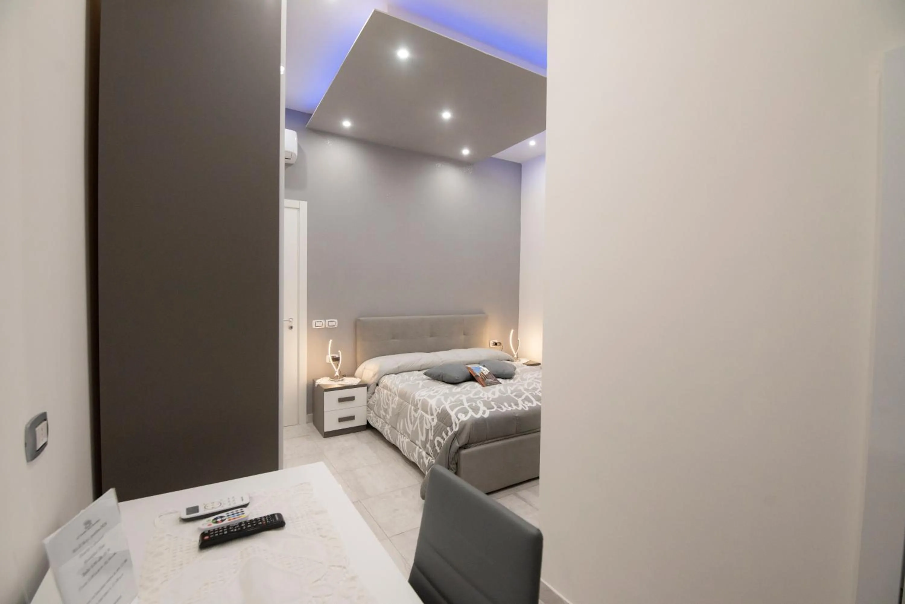 Bed in L'Isola Del Postino Rooms