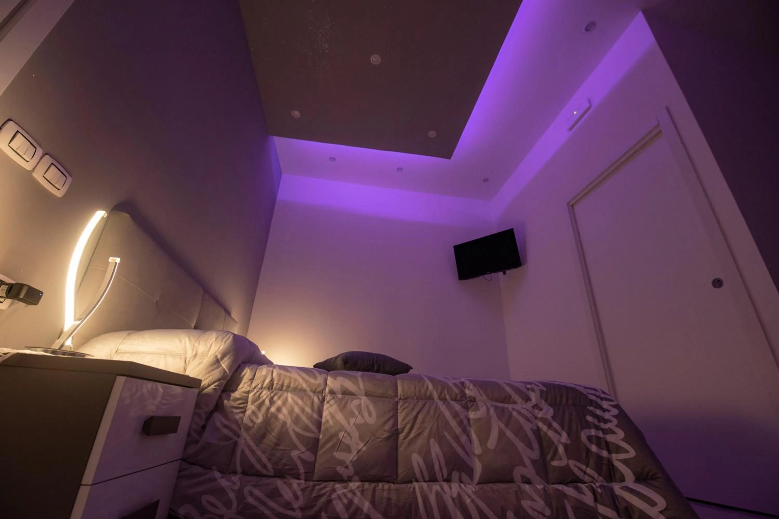 Bed in L'Isola Del Postino Rooms