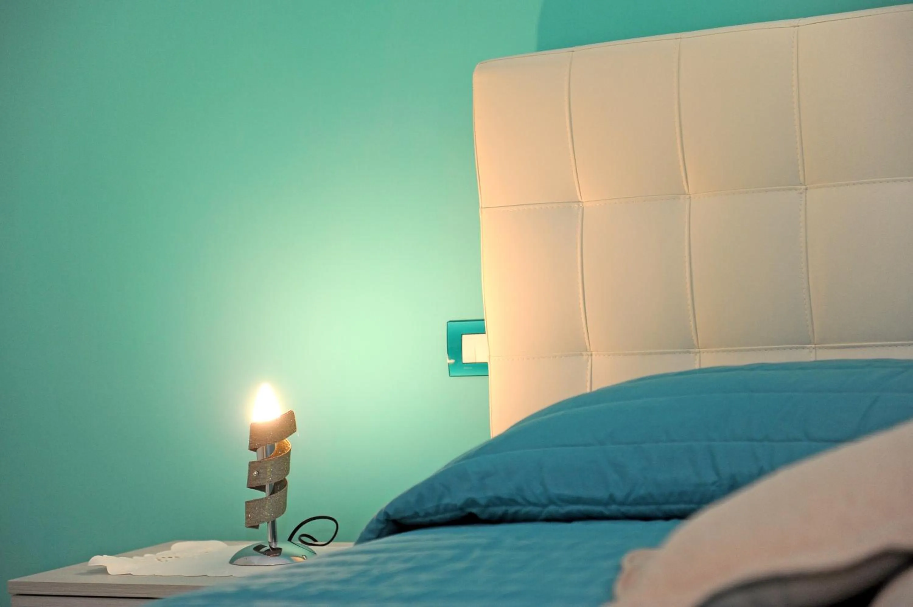 Bed in L'Isola Del Postino Rooms