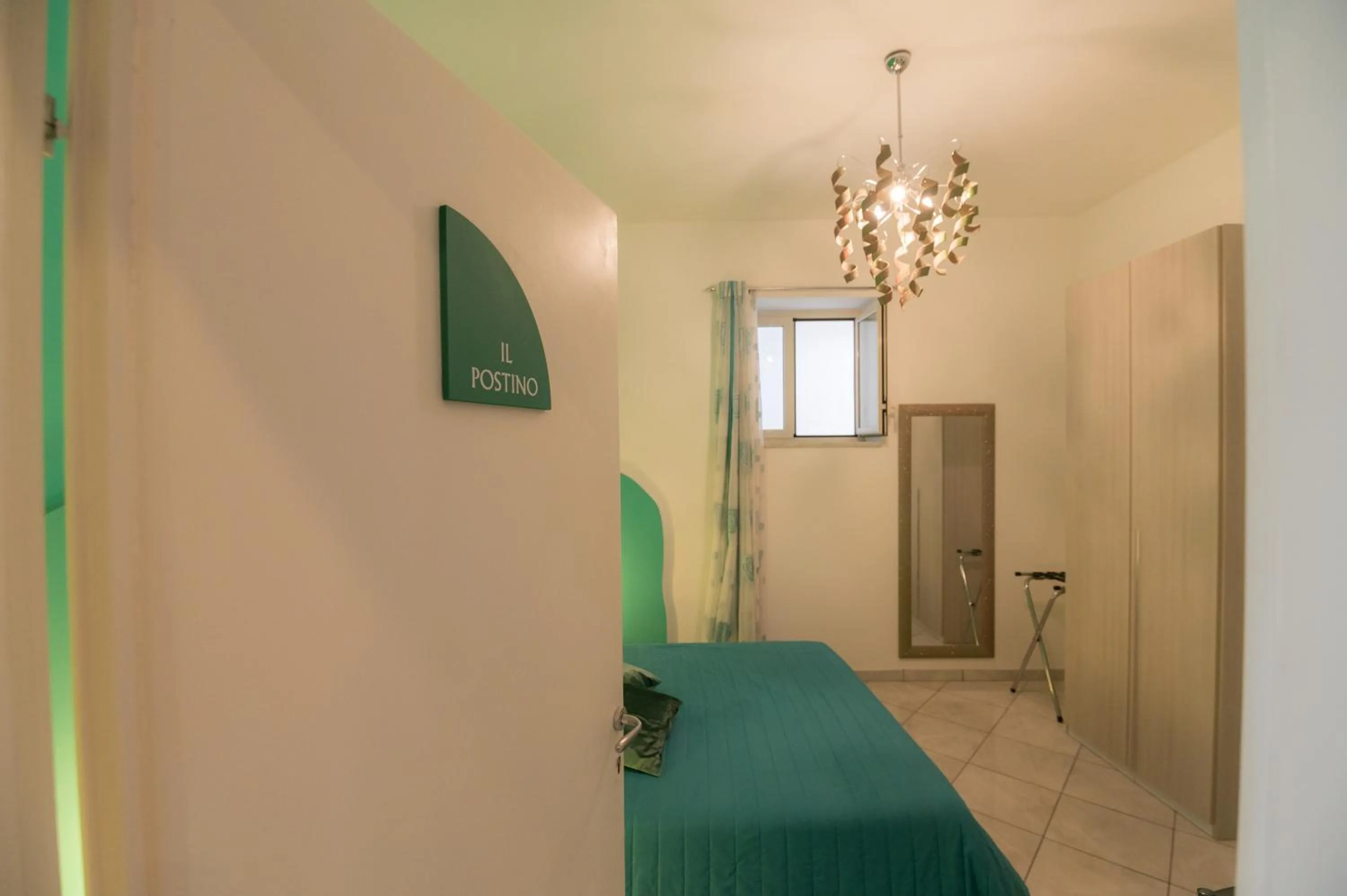 Bedroom in L'Isola Del Postino Rooms