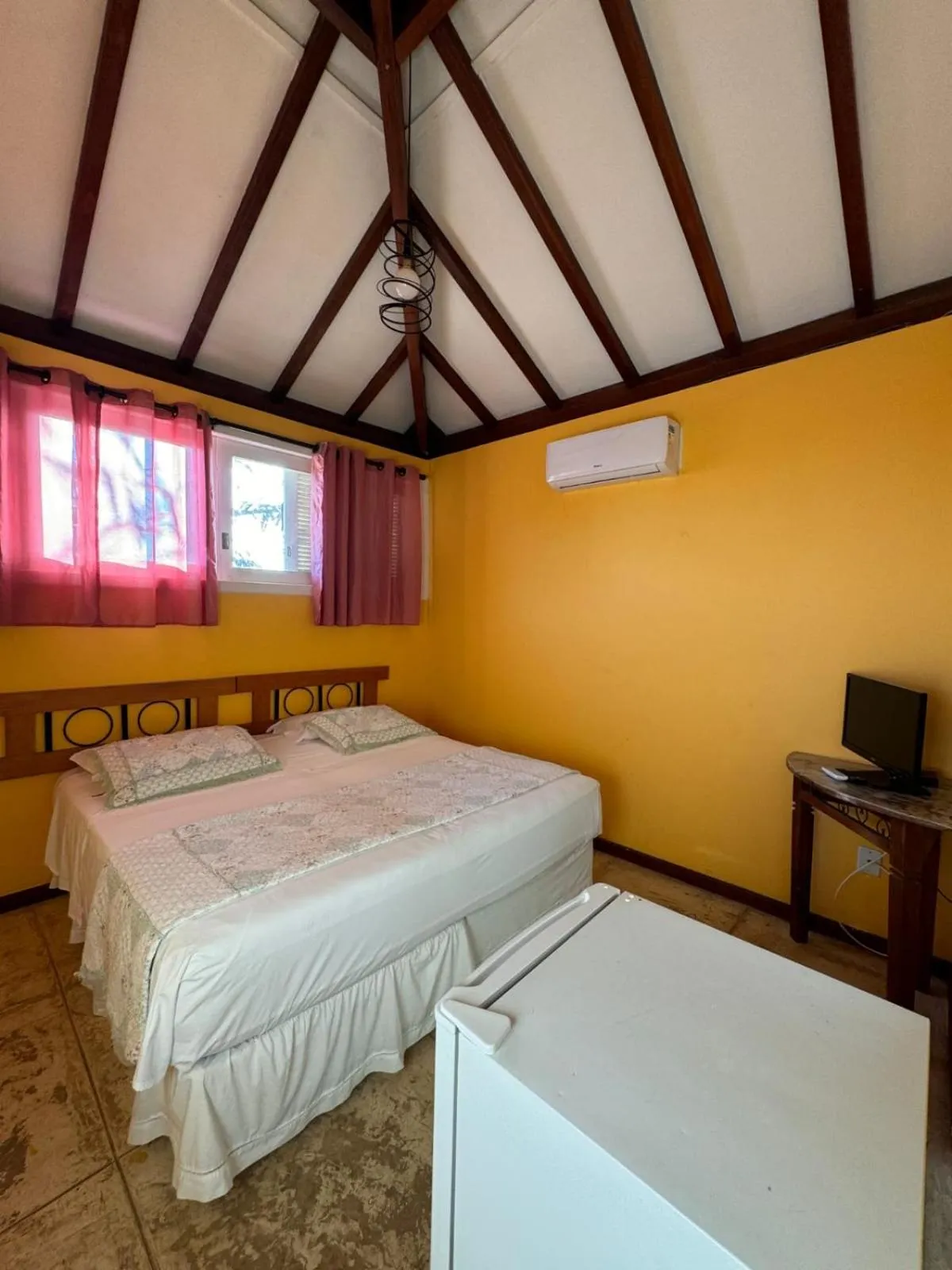 Bed in Bon Bini Pousada