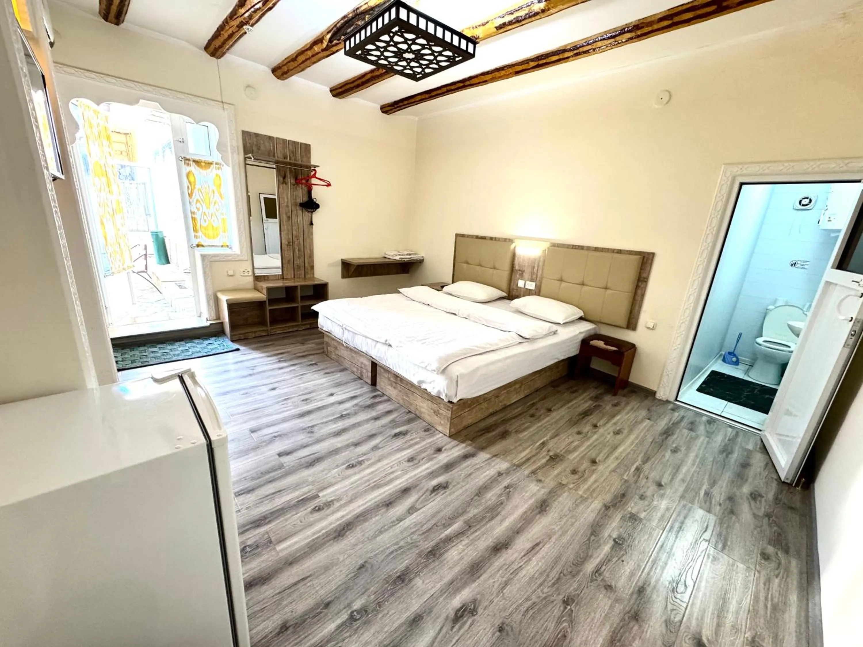 Living room, Bed in Bukhara house hotel