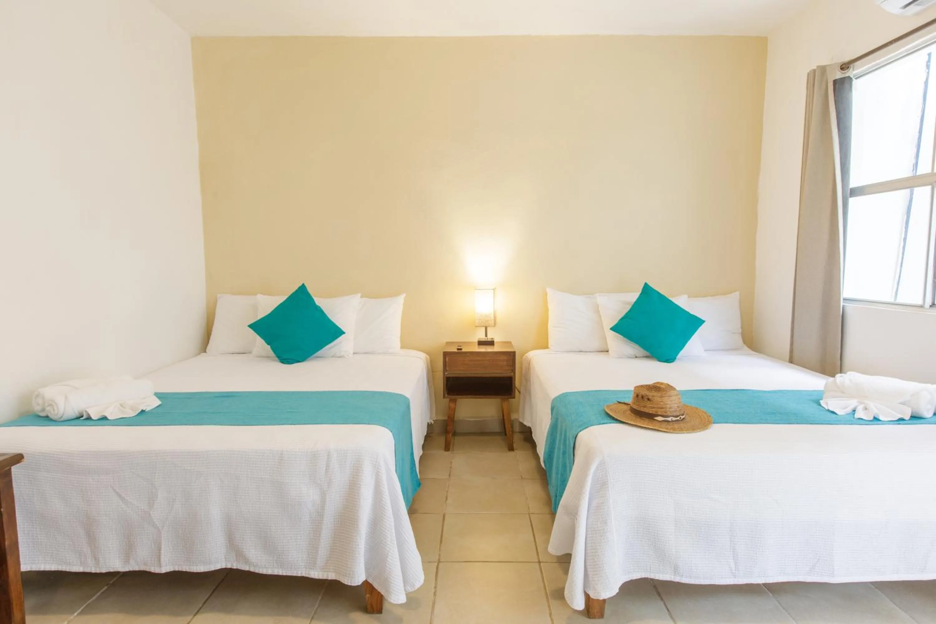 Bed in La Diosa Kali Beach Front Hotel