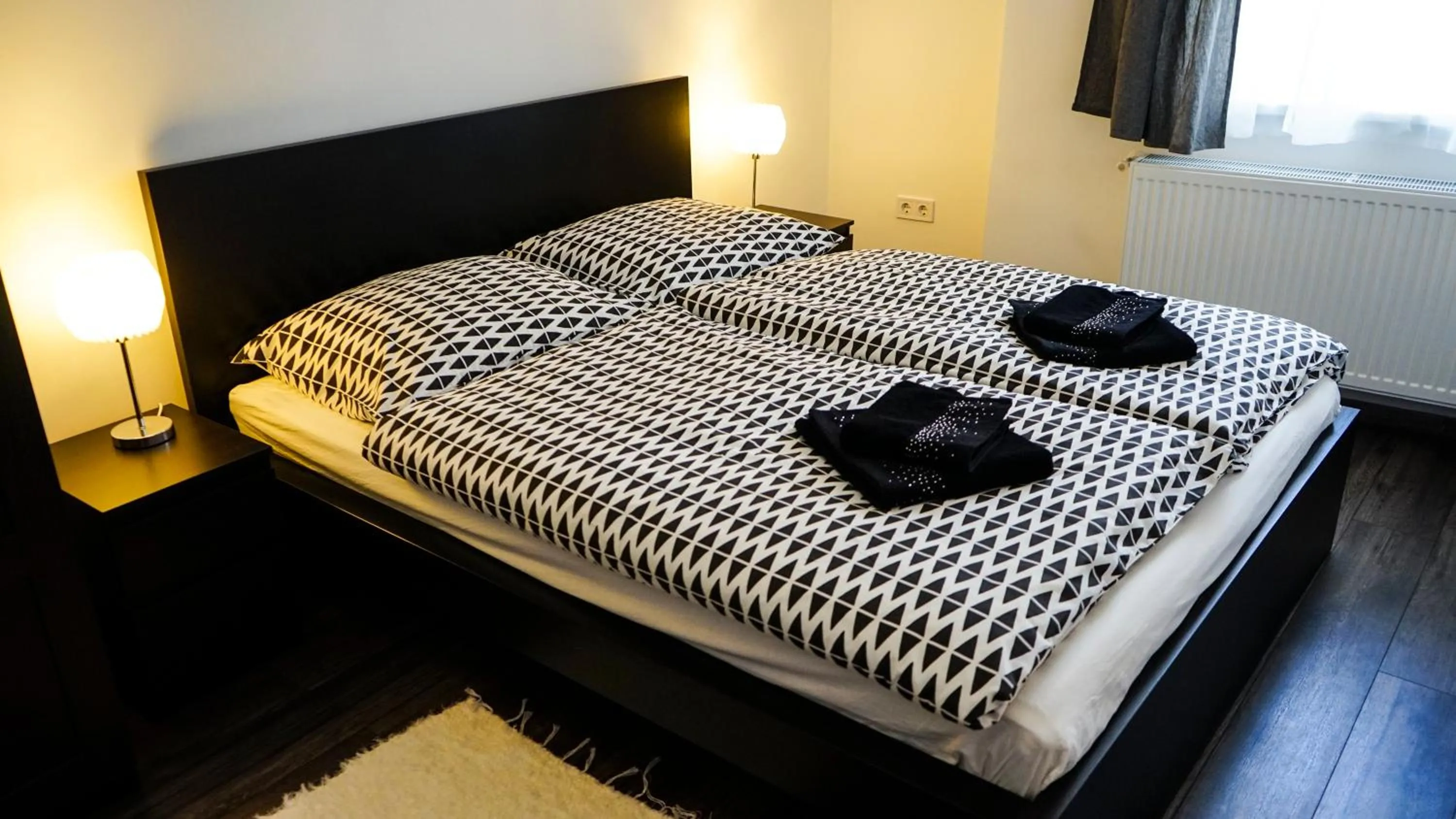 Bed in DownTown DeLuxe Apartment